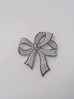 1920's Art Deco Platinum Diamond and Sapphire Bow Brooch