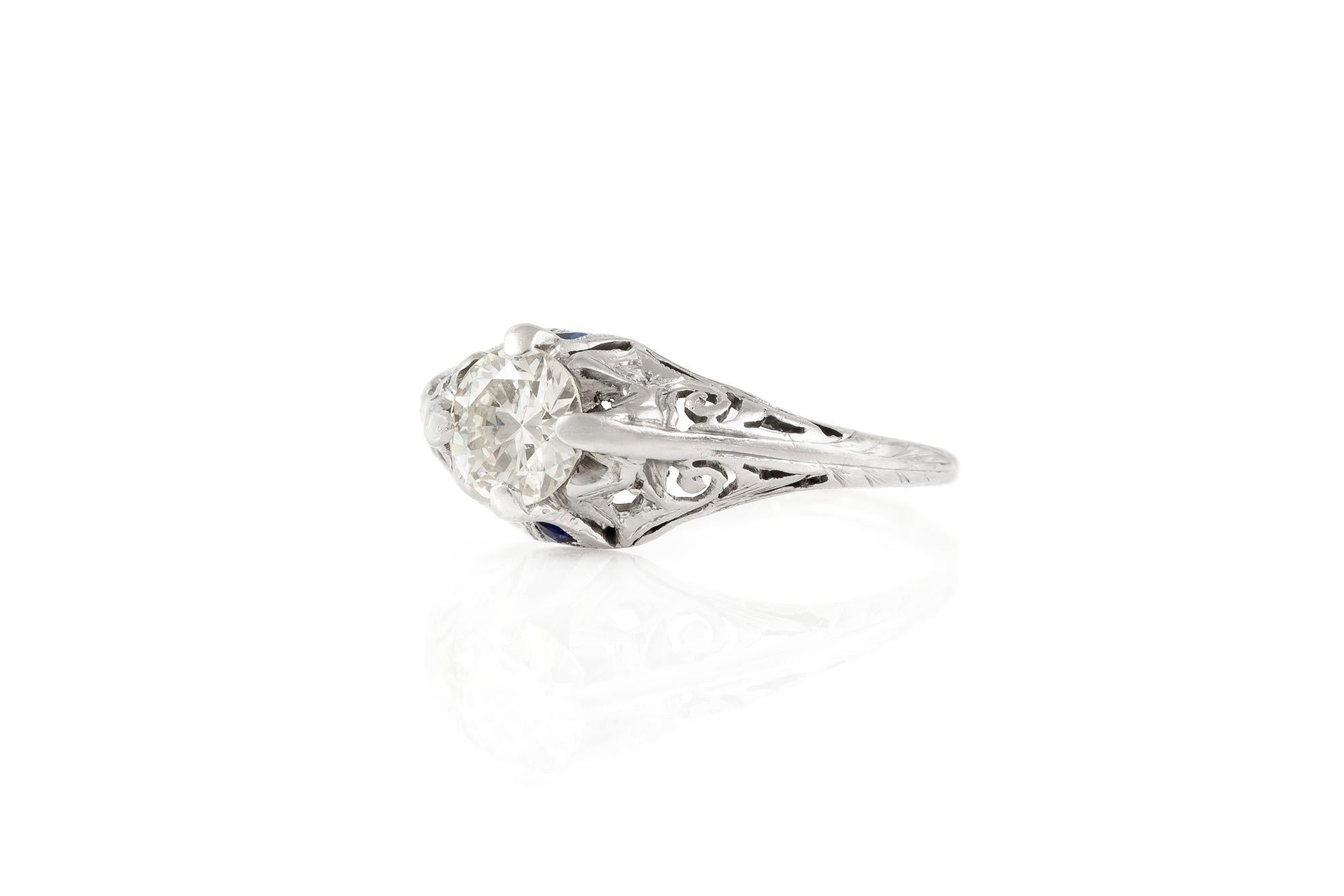 Round Cut 1920s Art Deco Platinum with 0.67 Carat Diamond and Sapphire Engagement Ring For Sale