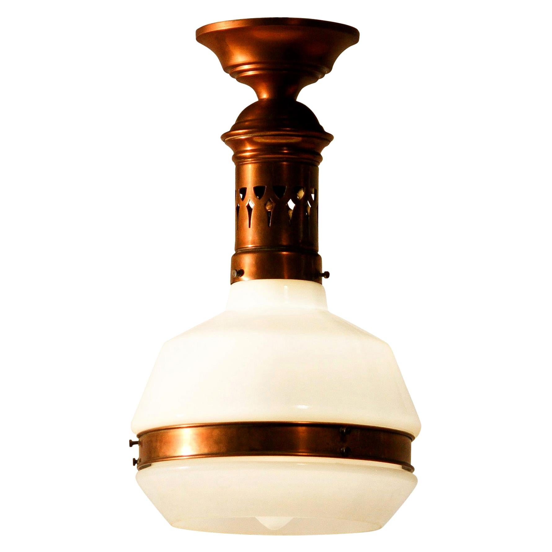 Beautiful Art Deco red copper pendant lamp with white satin finish glass hood.
In absolutely perfect condition.

   