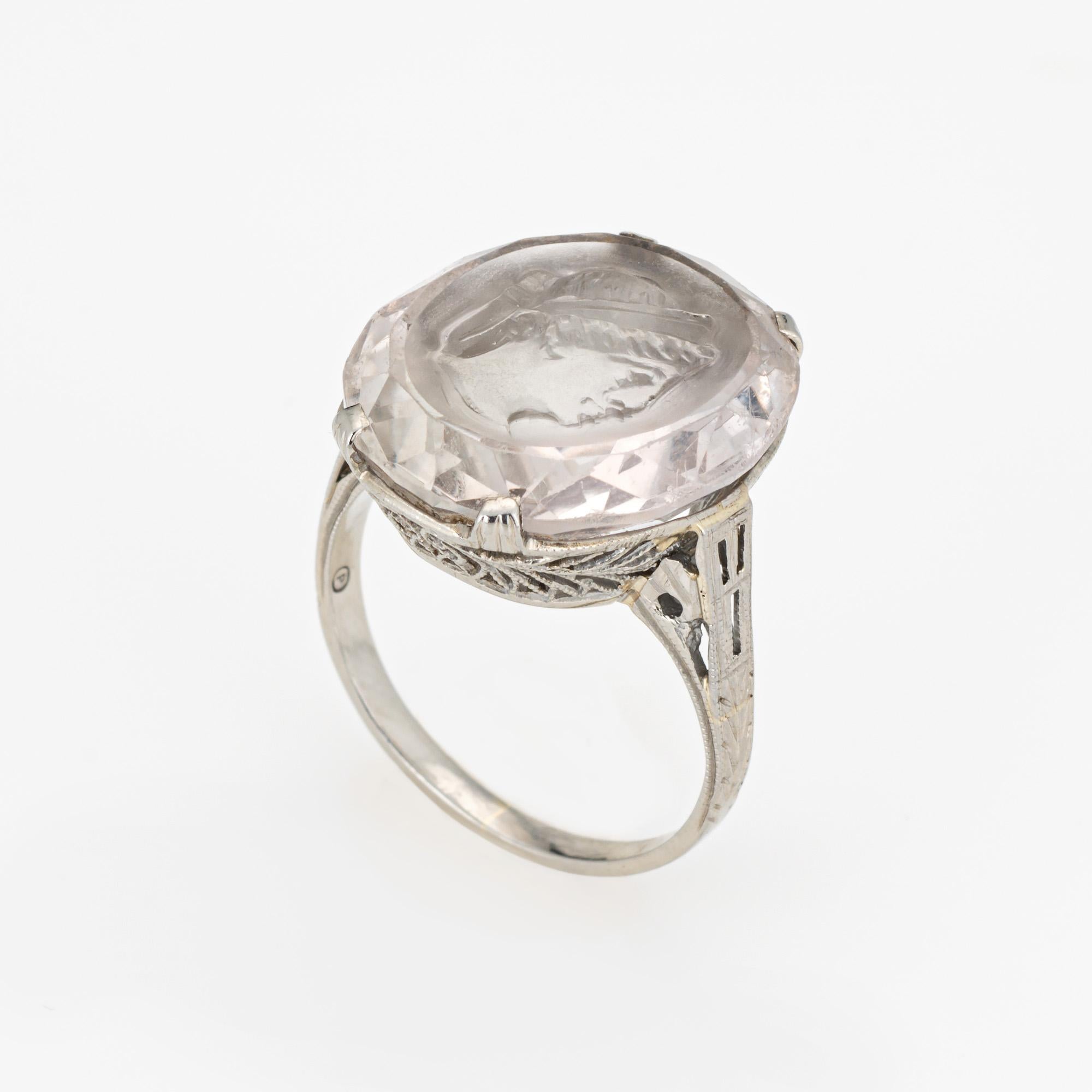 Finely detailed vintage Art Deco rock crystal intaglio ring (circa 1920s to 1930s) crafted in 18 karat white gold. 

Oval cut rock crystal measures 18mm x 15mm. The rock crystal is in good condition with light wear evident under a 10x loupe.

The