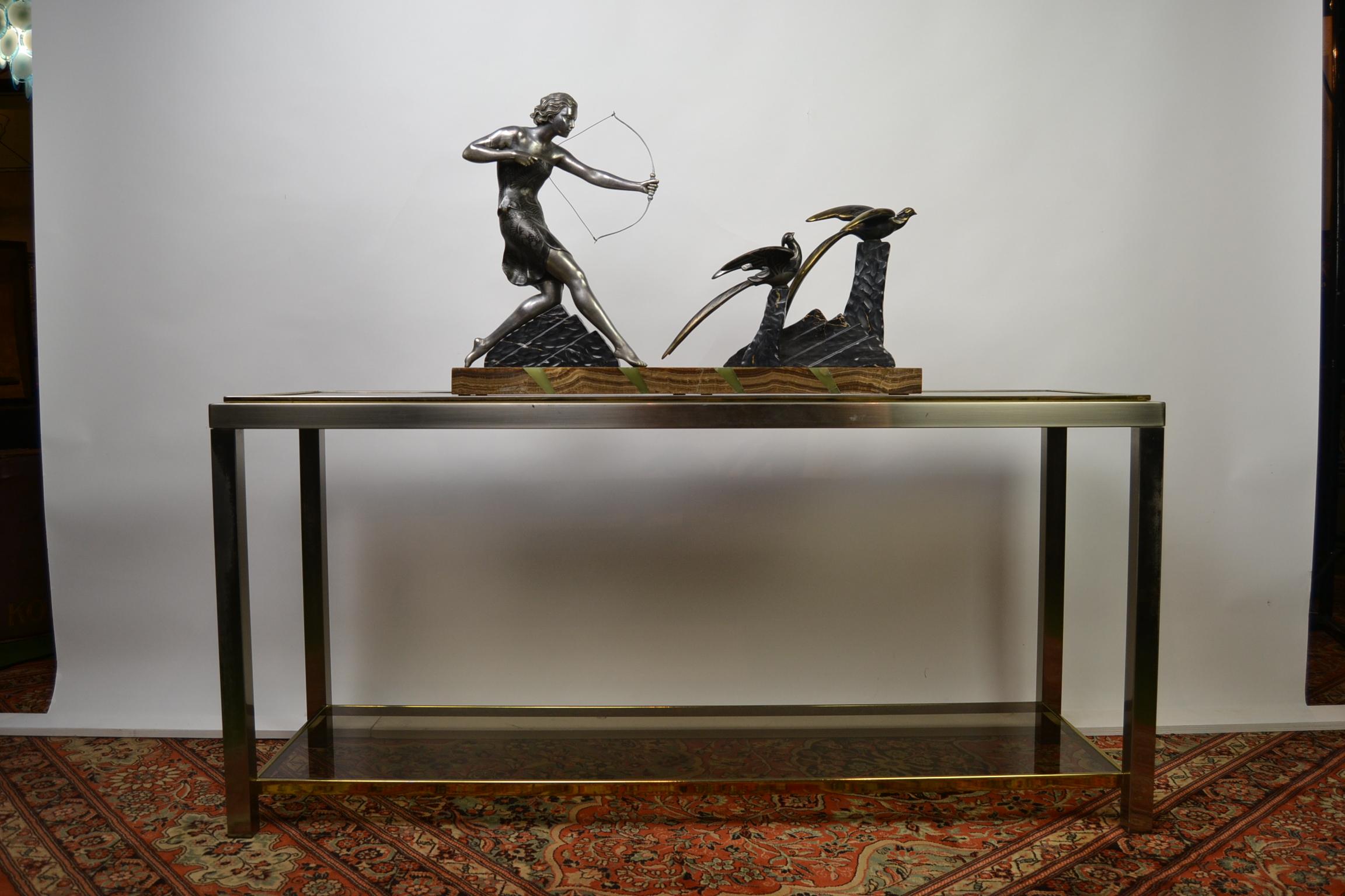 Impressive large Art Deco sculpture made and signed by Uriano.
Uriano was an Italian artist who worked in France. (1887-1960)
This piece of art dates from the 1920s-1930s: A huntress shooting two birds.
The lady and birds are made from Spelter,