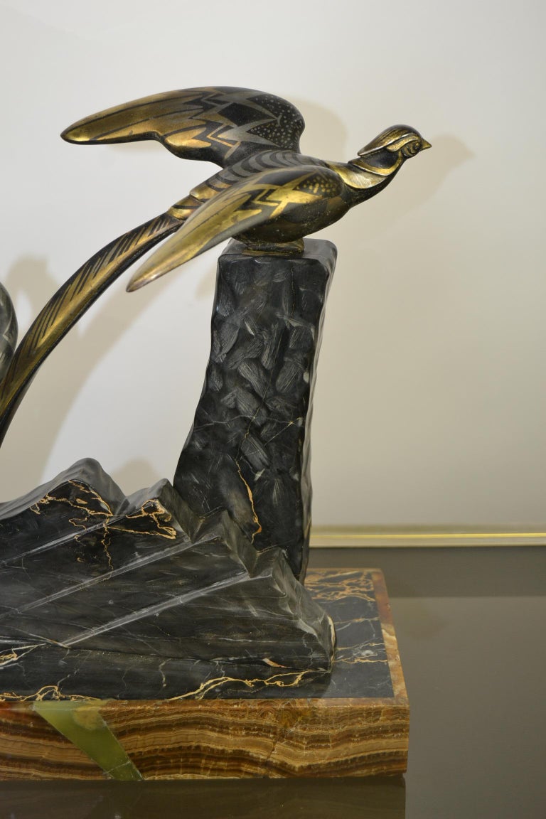 1920s Art Deco Sculpture by Uriano, Woman Shooting Two Birds at 1stDibs