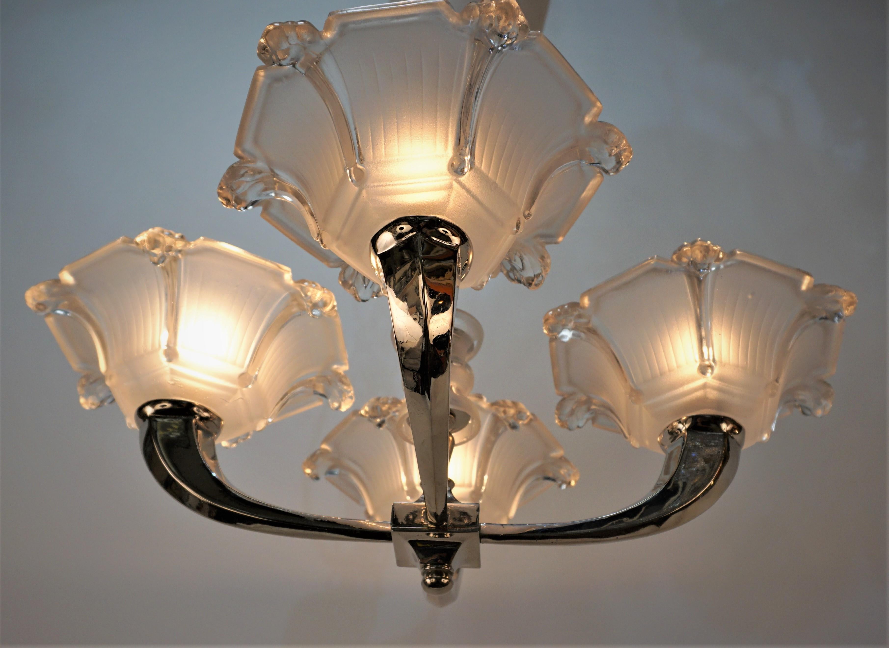 Clear frost glass, nickel on bronze frame 1920's art deco semi flush mount chandelier.
Professionally rewired and ready for installation.
Measurement: height 13