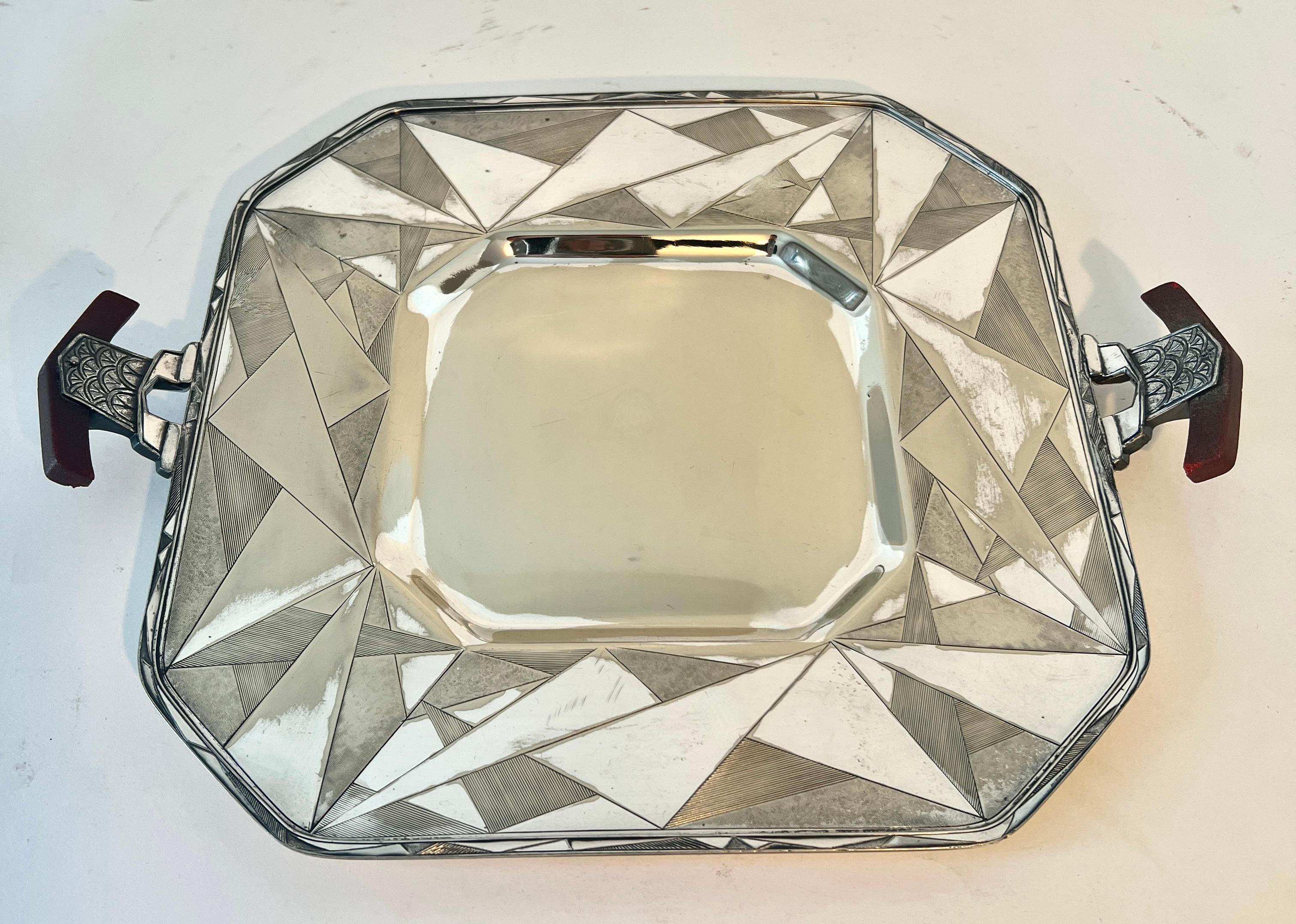 A wonderful Geometric Art Deco Silver Plate Tray, circa 1920.

the tray has a great look that works as well as a decorative piece or functional.  A compliment to the entry to hold keys, to the desk or work station to hold mail or notes, to the