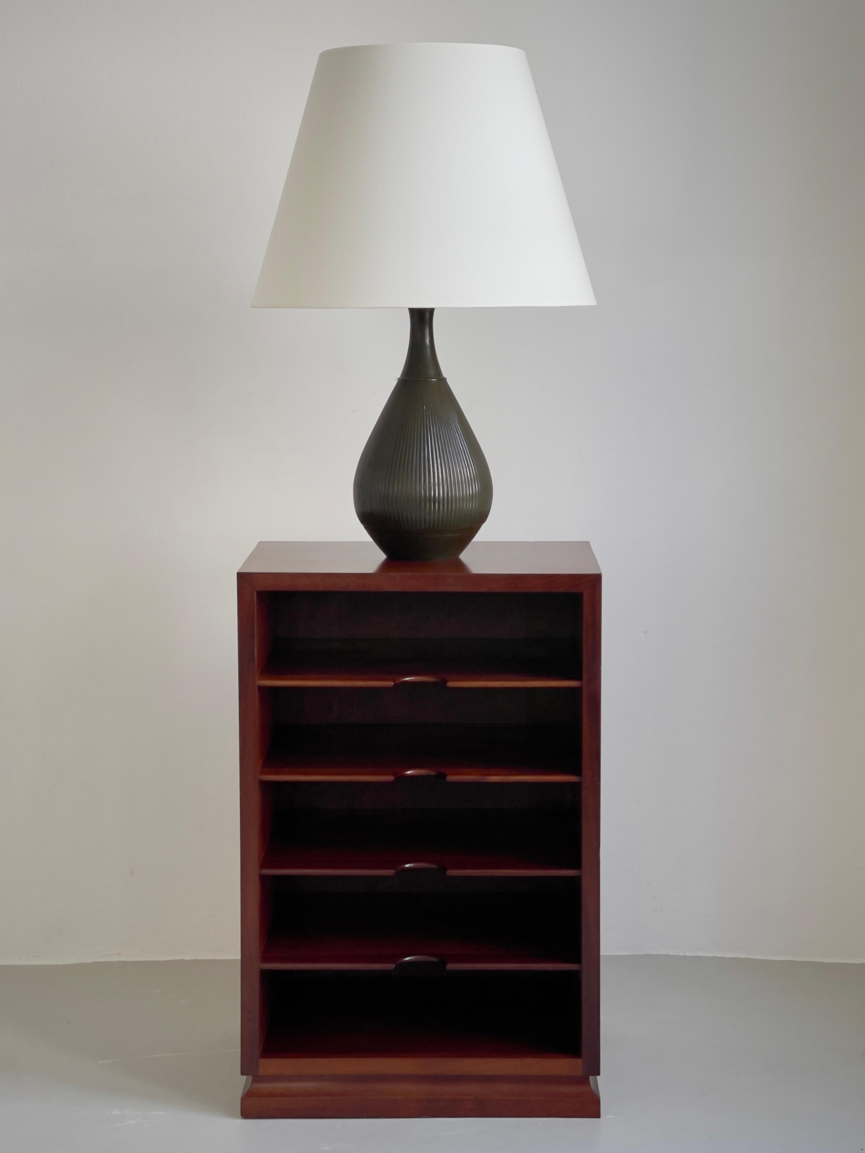 This pristine condition and distinguished 1920s Art Deco table lamp by Danish sculptor and silversmith Just Andersen is a masterful example of his sculptural approach to functional objects. Produced in Copenhagen, the lamp is crafted in Andersen’s