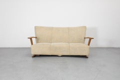 Sofá Art Decó de tres plazas de los años 20 con cuerpo tapizado y estructura de roble