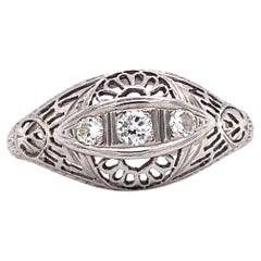 Antique 1920s Art Deco Three Stone Diamond Filigree Ring in 18 Karat White Gold