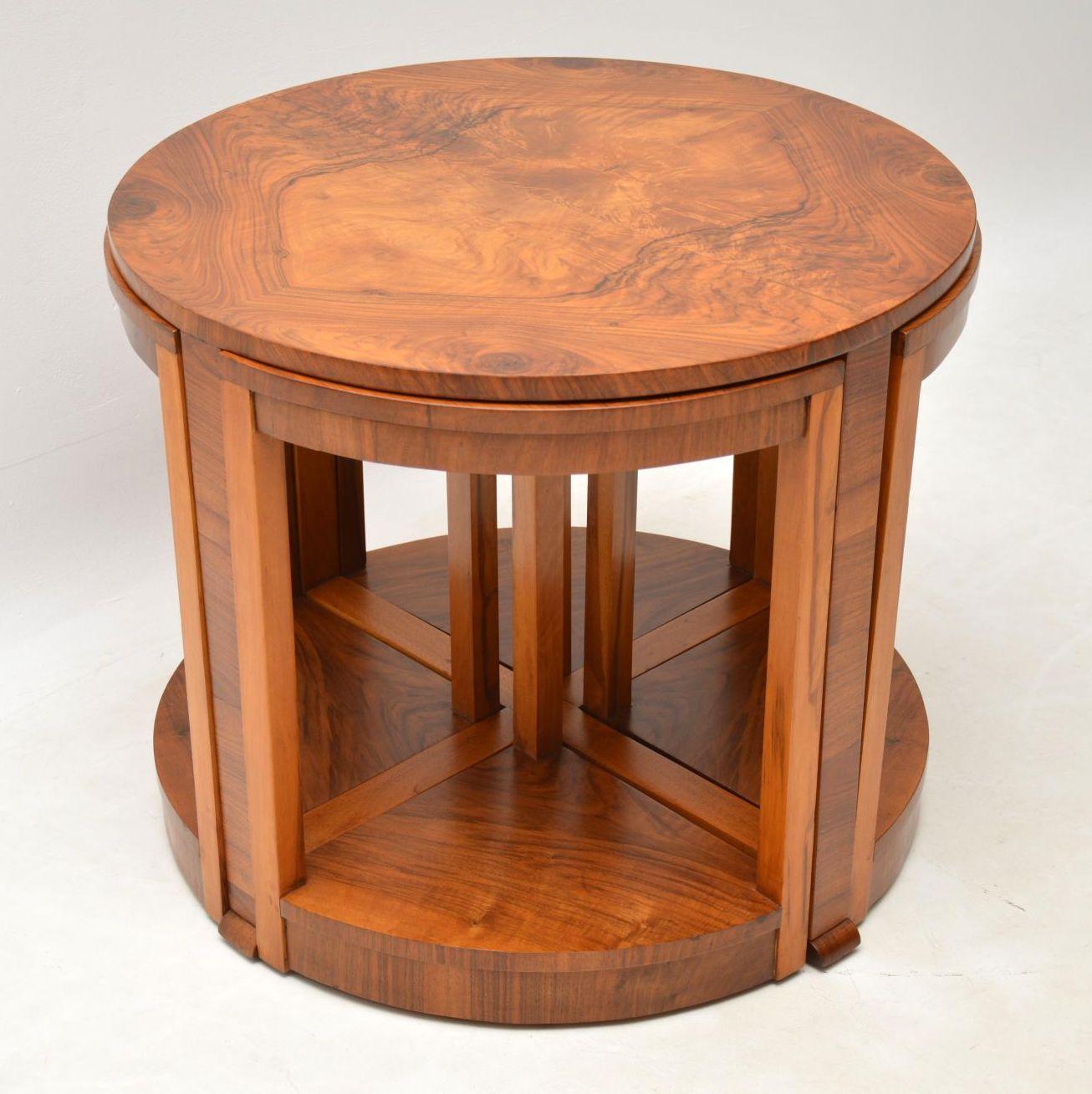 A beautifully made original Art Deco nesting coffee table, in stunning figured walnut. It dates from around the 1920s-1930s period. This consists of a larger circular coffee table, with four pie shaped smaller tables that nest beneath the top. We