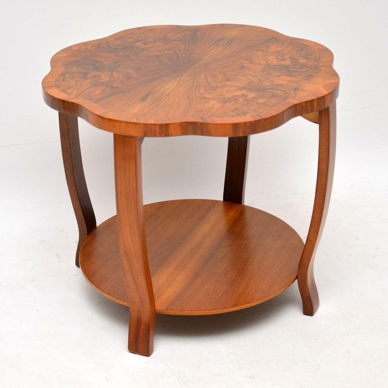 A beautiful original Art Deco period coffee table in walnut, this dates from the 1920s-1930s. It has a lovely shape and has an additional lower tier which is always useful for extra storage. We have had this stripped and re-polished to a very high