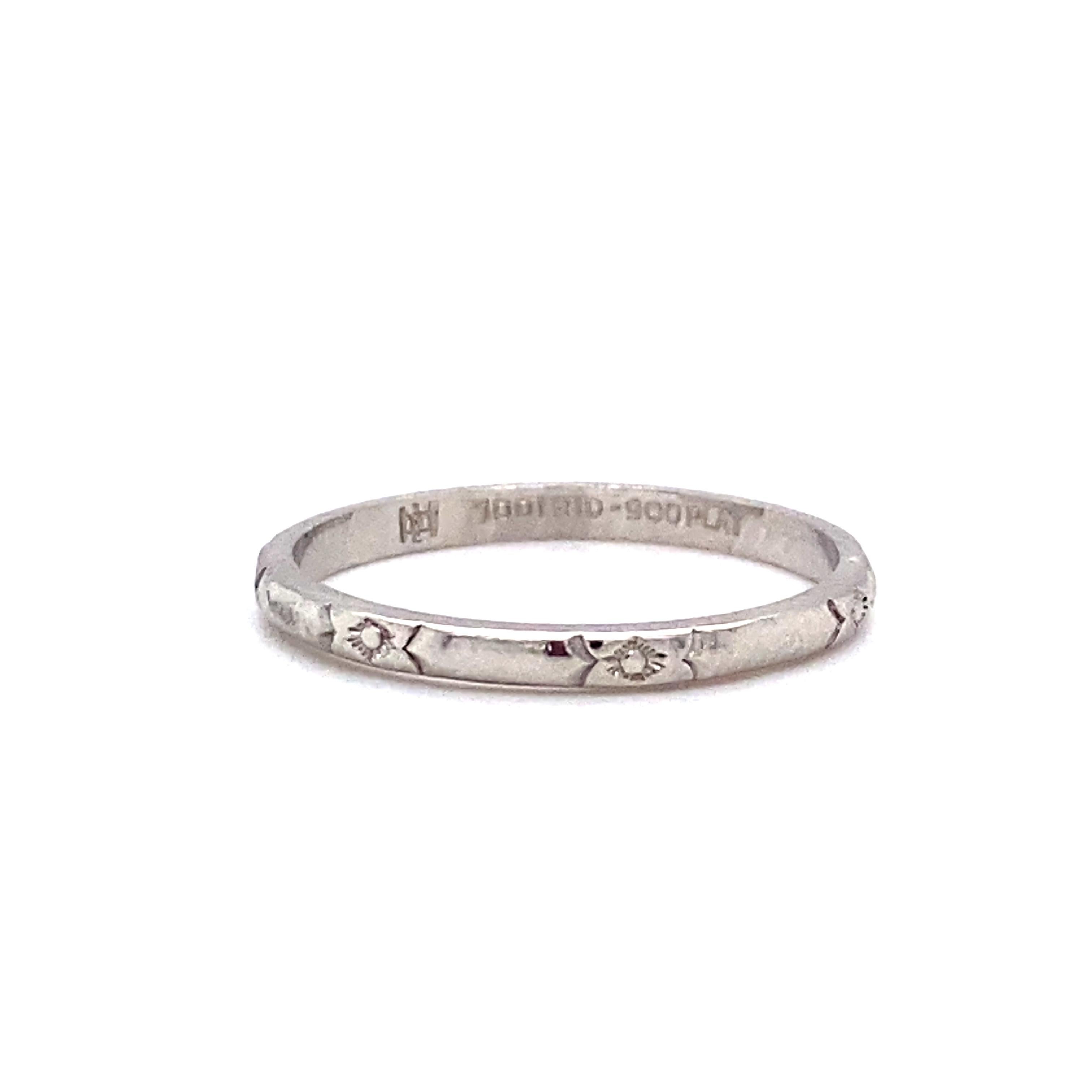 Circa: 1920
Metal Type: Platinum
Weight: 2.3 grams
Size: US 6.5, cannot be resized

Dainty ring with simple etching design along the band.
Hallmarked Platinum