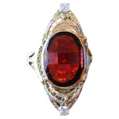 1920s Art Deco Yellow and White 14 Karat Gold Garnet and Diamond Ring