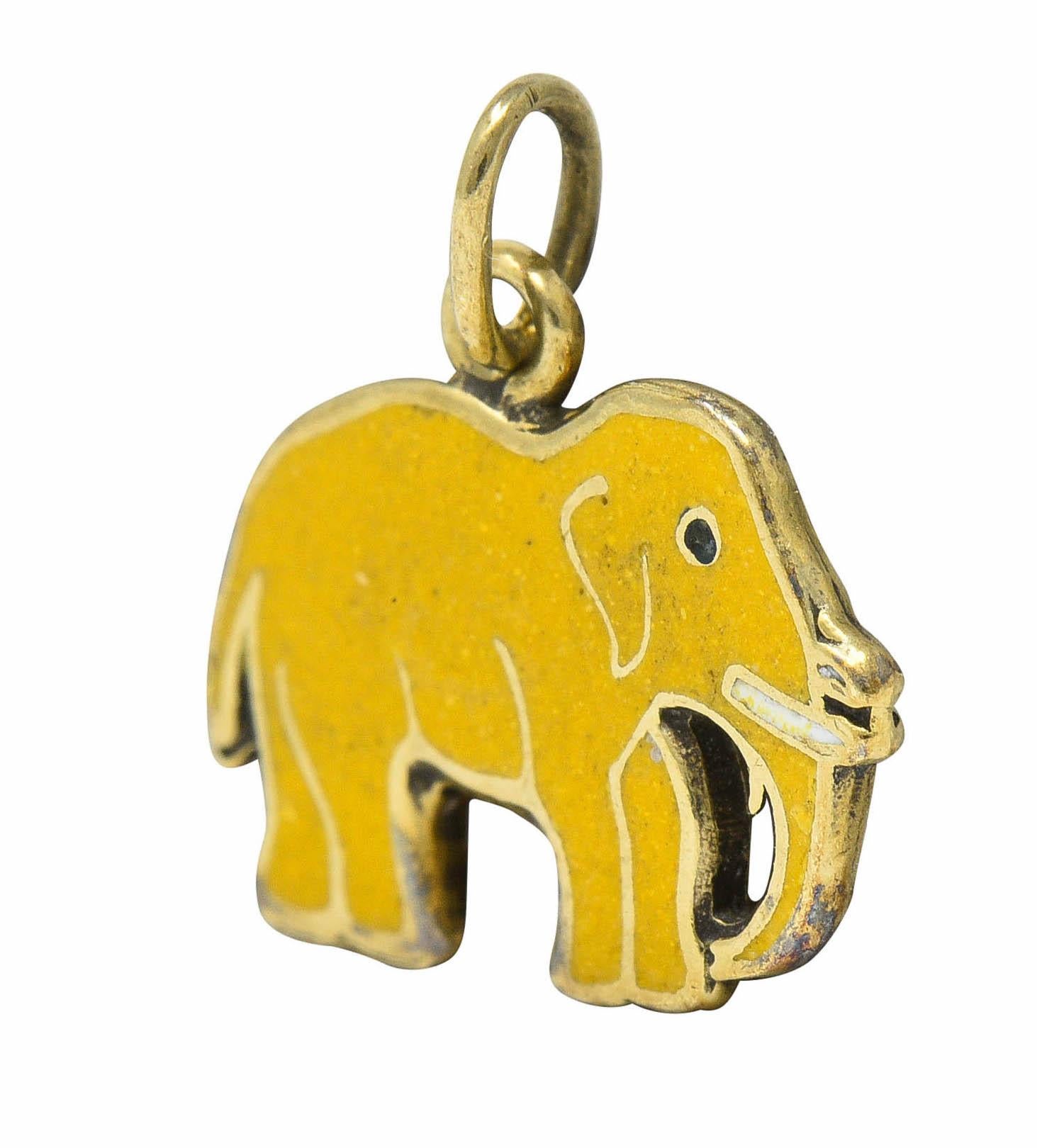 Charm is designed as a stylized elephant glossed with yellow enamel, exhibiting minimal loss

With black enamel eyes and white enamel tusks

Depiction is featured on both sides of charm

Tested as 14 karat gold

Circa: 1920

Measures: 9/16 x 9/16