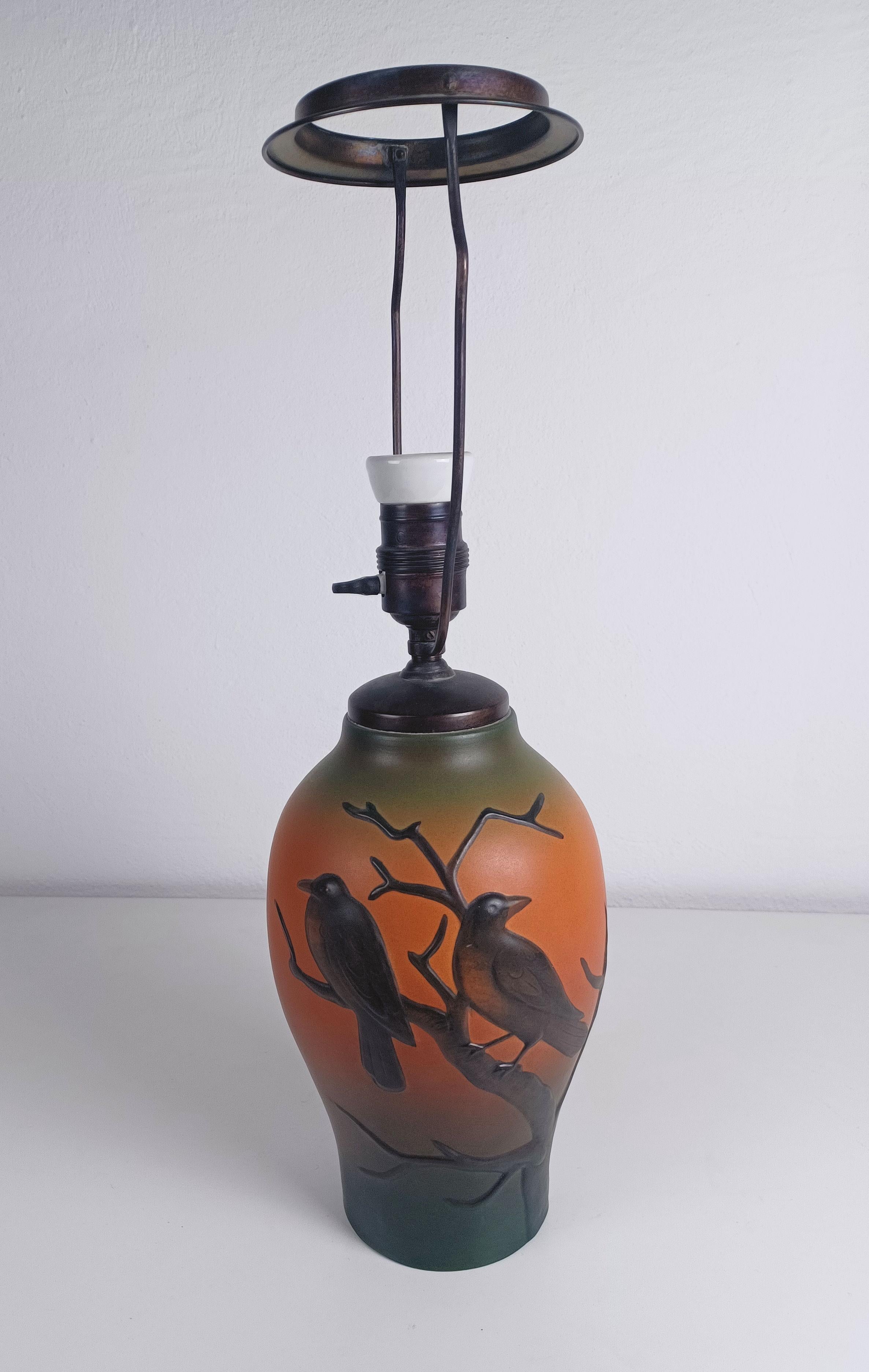 1920sArt Nouveau hand-crafted table lamp by Georg Thylstrup for P. Ipsens Enke

The hand-crafted art nouveau table lamp was designed by eorg Thylstrup in 1927 and feature  two craws sitting on a branch. 

The table lamp is in very good  vintage