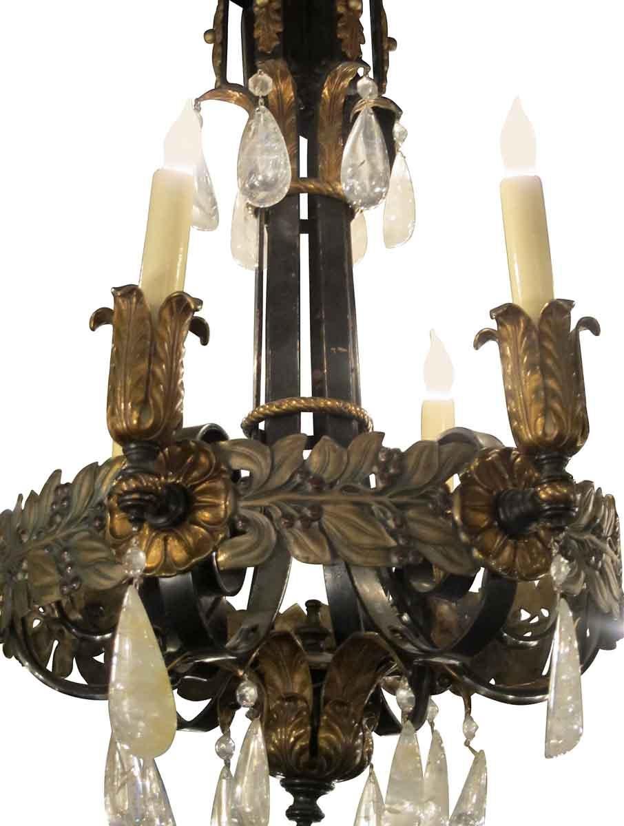 American made iron and bronze six-light chandelier from the 1920s, designed in an Art Nouveau style with rock crystals. This can be seen at our 2420 Broadway location on the upper west side in Manhattan.