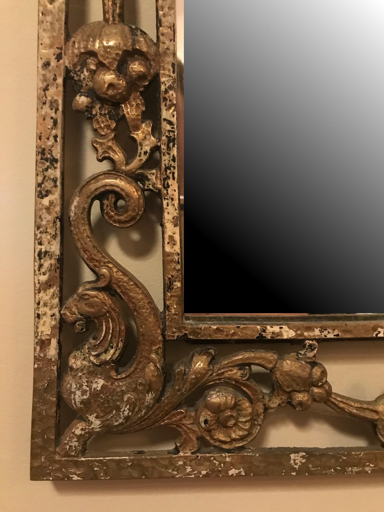This beautiful 1920s Arts & Crafts mirror is designed by Oscar Bach. It is made of cast iron in an openwork design with ornate, neo gothic elements.

The mirror measures 34?H x 0.5? D x 24.50? W.

Oscar Bruno Bach (Breslau, Germany, 1884 - New York,