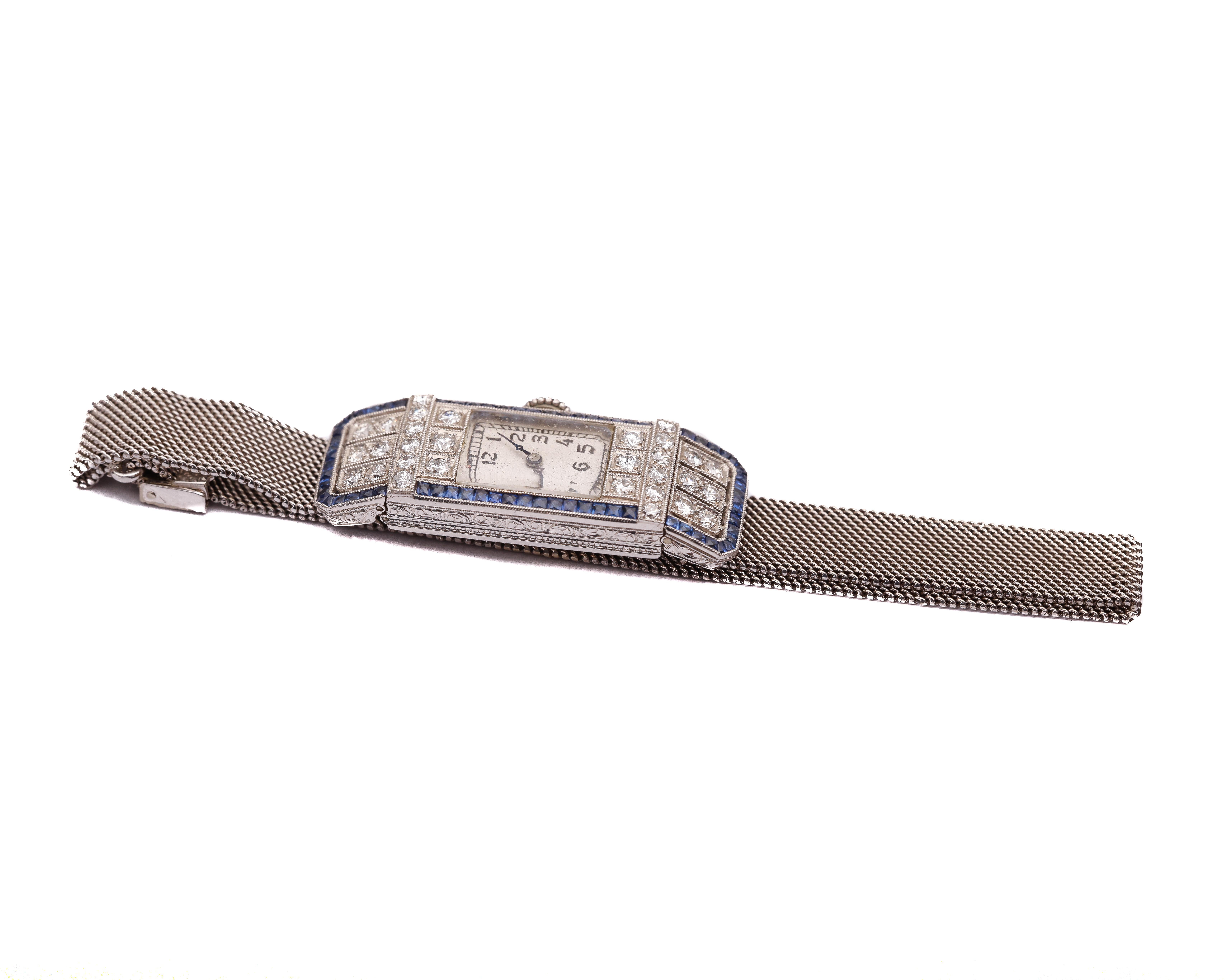 Mesh - White Gold 18 Karat
Head - Platinum 

Diamond Details
Color: G
Clarity: VS
Cut: Single Cut
Carat: .6 Carats

Features:
Sapphire Baguettes French Cuts
Head and Case are Platinum 
Mesh on the Watch is 14 Karat White Gold 
The woven mesh band is