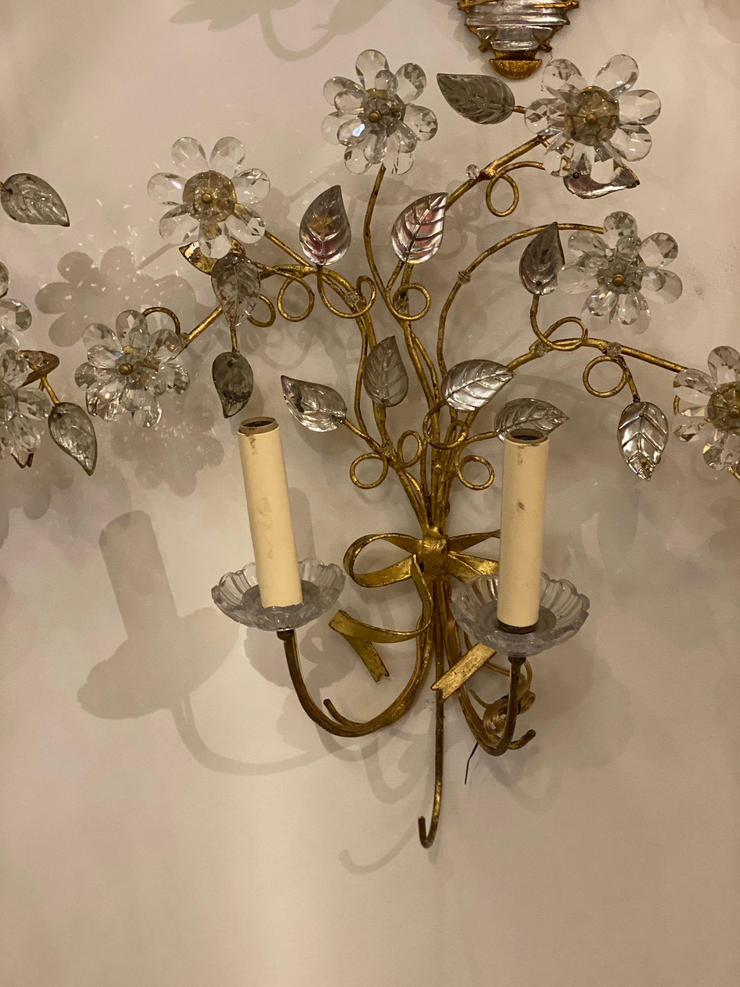A pair of circa 1920’s Bagues sconces with flowers design and two lights