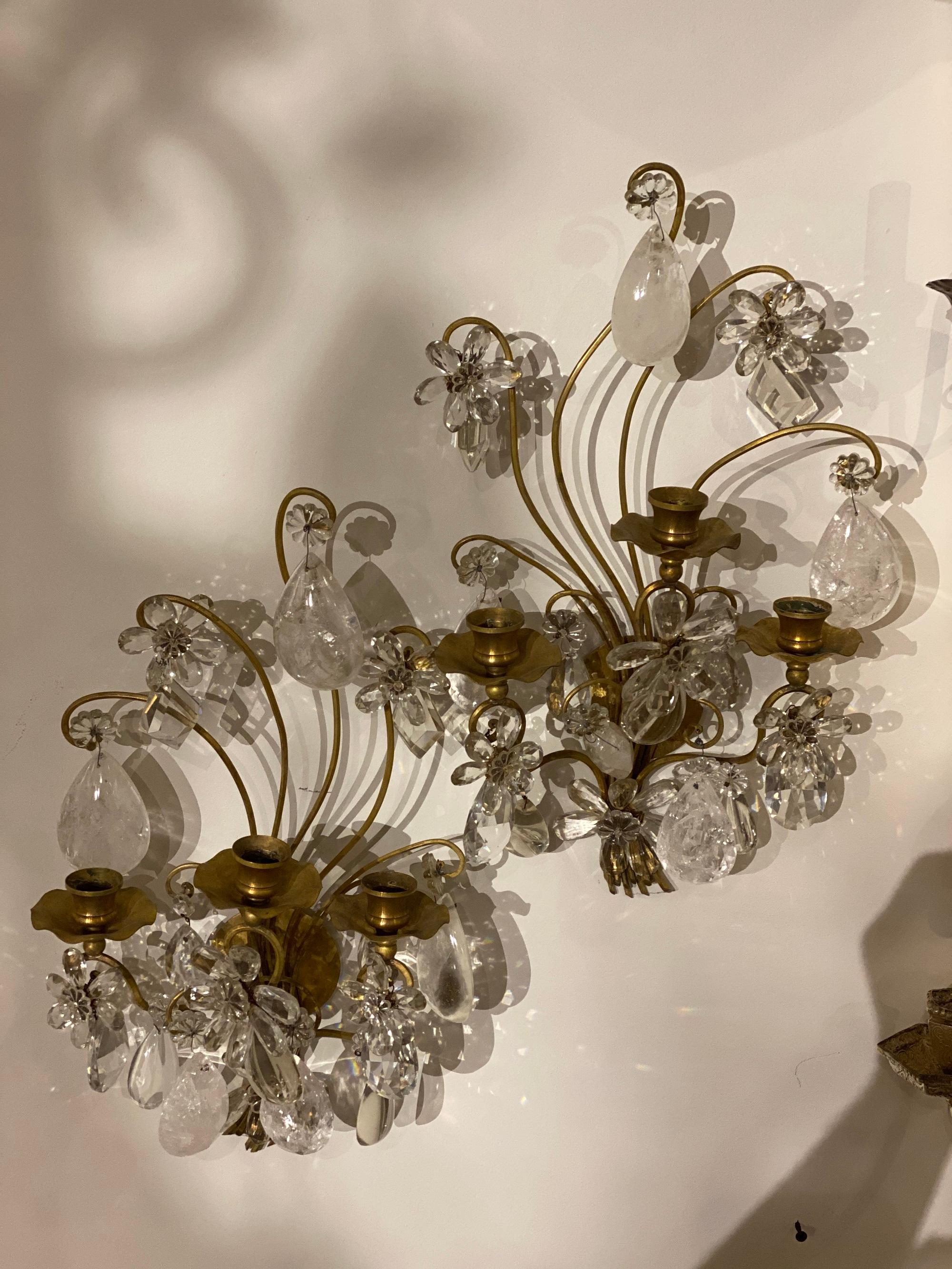 A pair of 1920’s gilt bronze Bagues sconces unusual shape with rock crystals hangings and crystal flowers. In very good vintage condition. 

Dealer: G302YP 