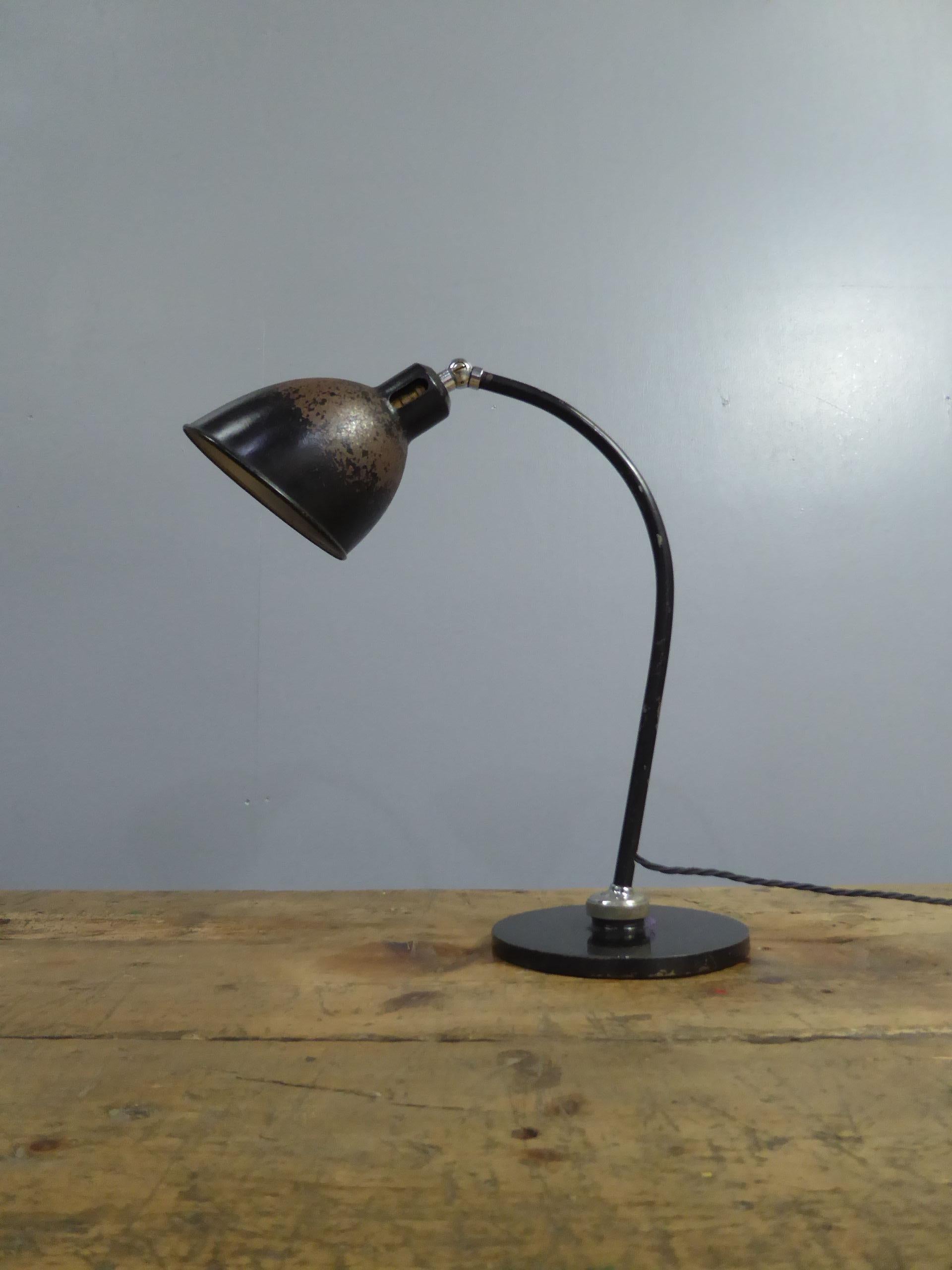 A rare early vintage Bauhaus table lamp by Christian Dell for Bunte & Remmler.
The 'Polo Popular', a wonderful & exceptionally original example of this rare German classic with a spun steel shade, adjustable chrome ball jointed arm & a cast iron