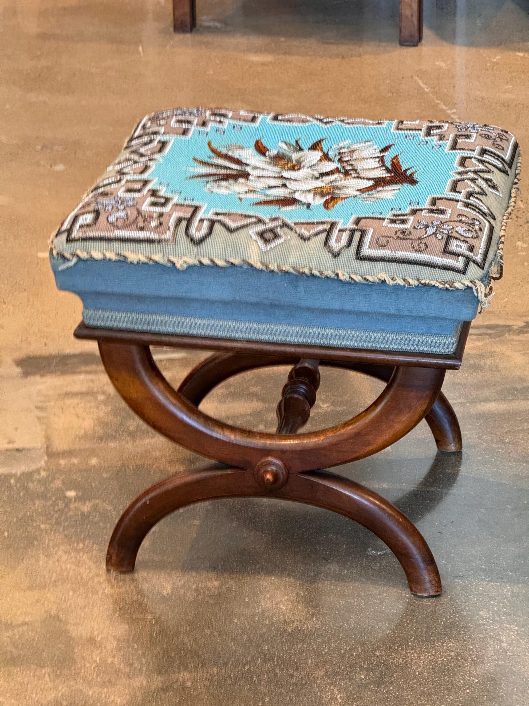 This stool has a beautiful beaded covering. A classic design.
