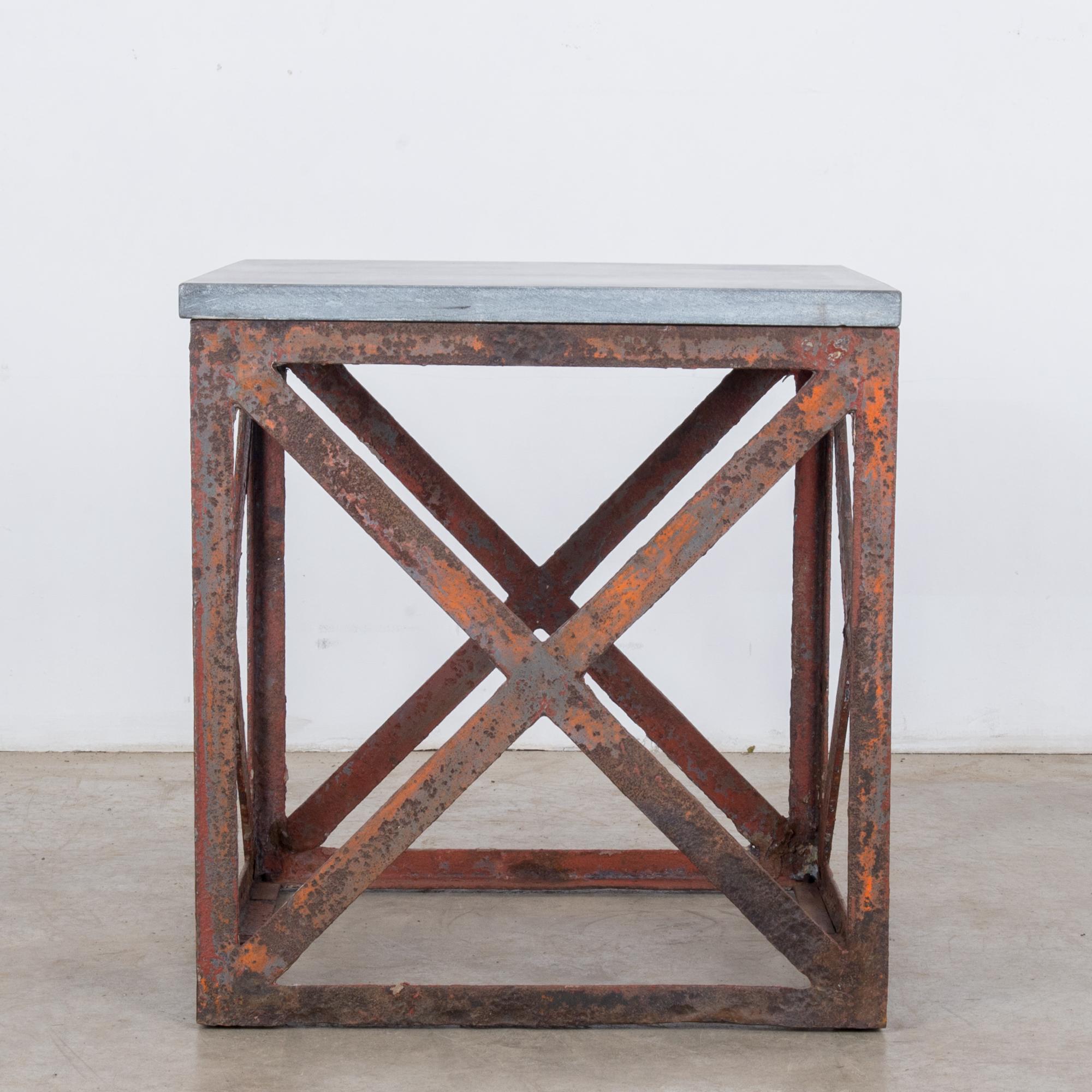 This square side table with a metal frame and a stone top was made in Belgium, circa 1920. The X-form stretchers on all sides accentuate the geometric nature of the table, and the cool gray stone top highlight the beautifully rusted patina of the