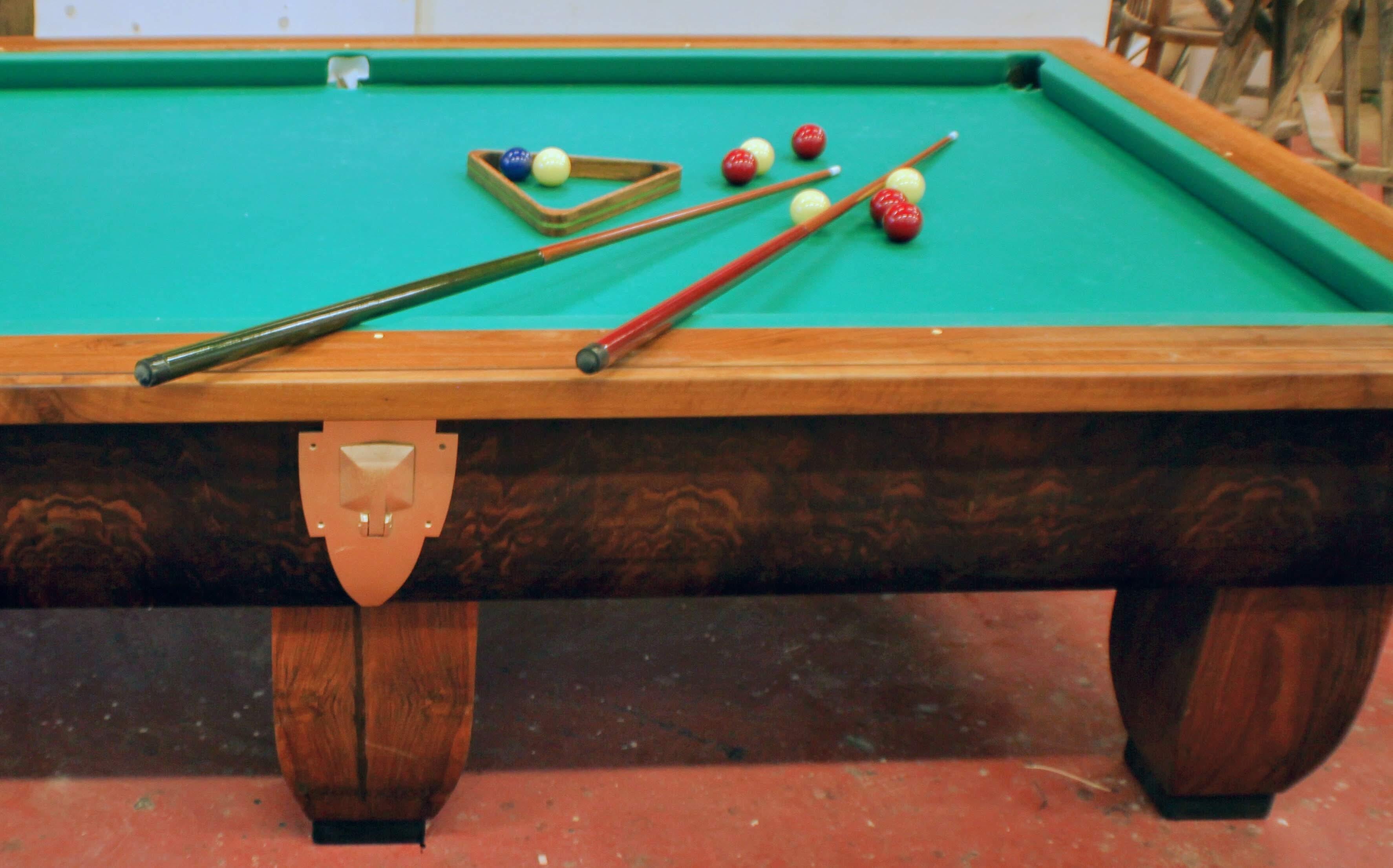 Beautiful Italian 20s pool table, very good condition, bakelite marbles, brass details, original cues and scorecards included.

Please note that all of our items are shipped after a microwave woodworm treatment, grouting woodworm holes and a deep
