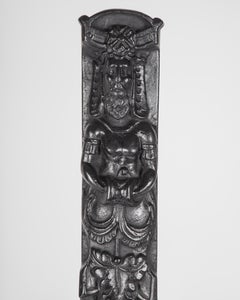 1920s Black Cast Iron Andirons with Figures of a Hybrid Atlas over a Caduceus