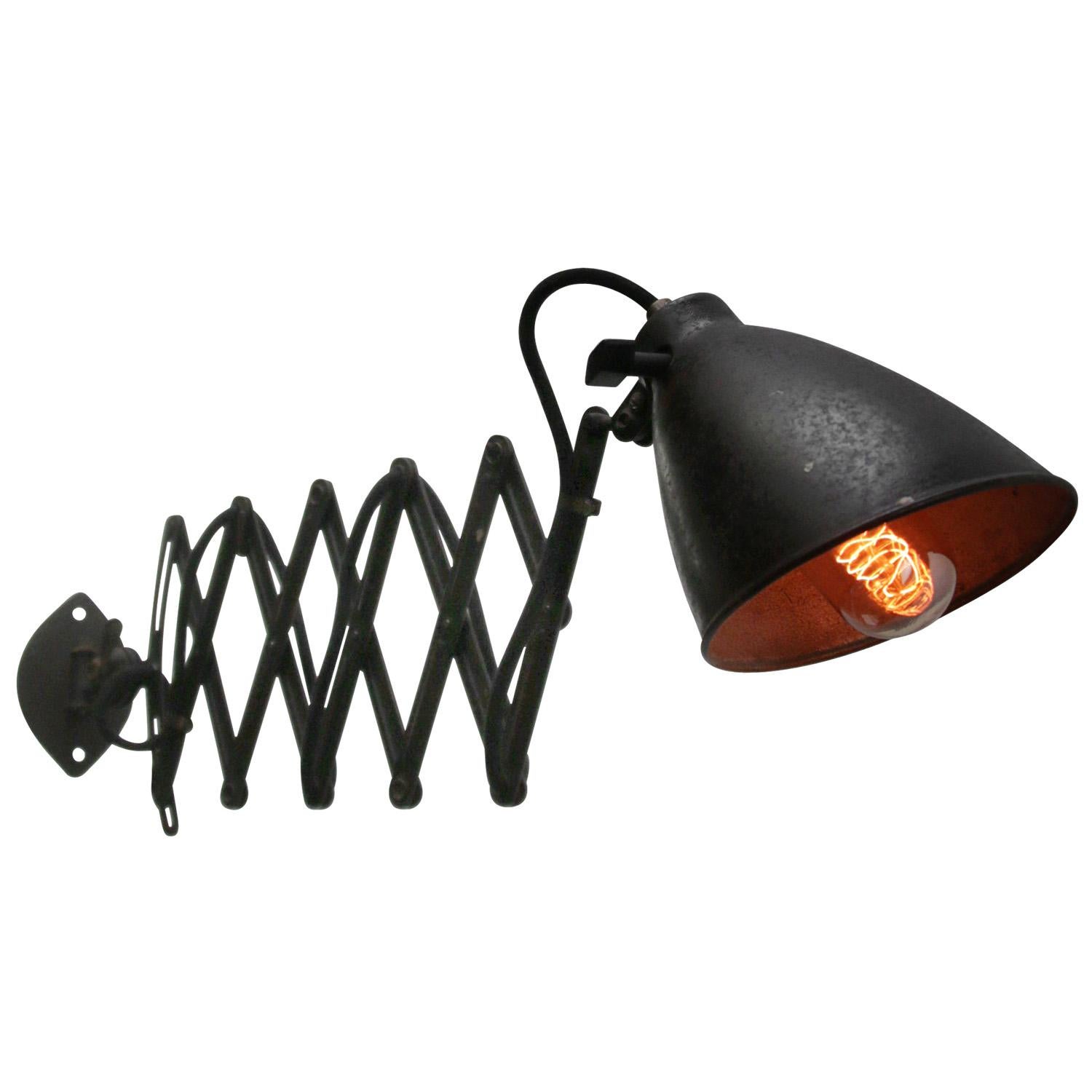 SIS scissor wall lamp
Black (old repaint) metal scissor or shade and silver interior adjustable length and horizontally and vertically swiveling arm

Shade size: Diameter 16 cm
90° angle adjustable shade

1920s iron single scissor wall