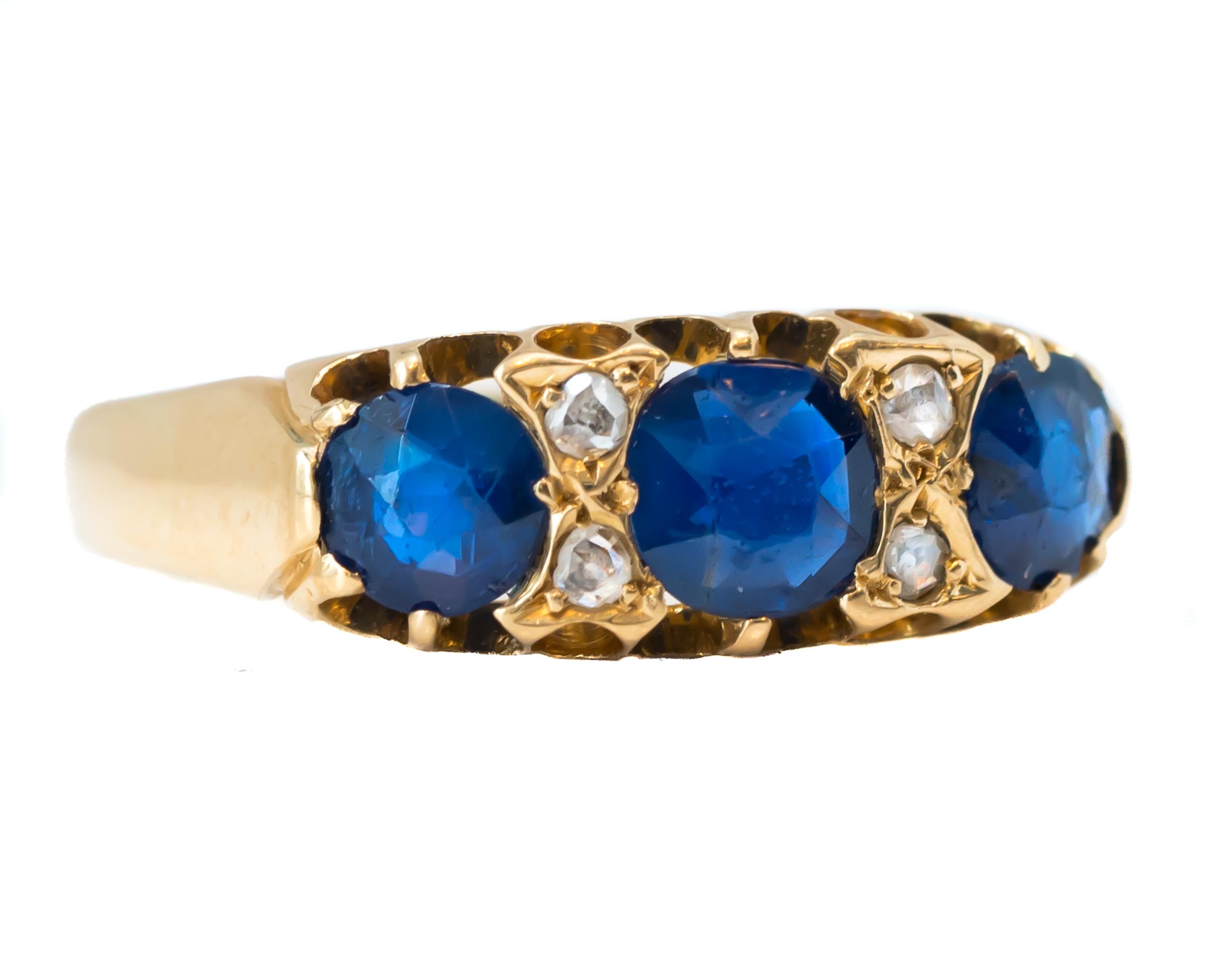 1920s Art Deco Sapphire and Diamond Ring - 18 karat Yellow Gold, Blue Sapphires, Diamonds

Features:
3 Round Blue Sapphires and 4 Old Mine cut Diamonds
18 karat Yellow Gold Cathedral setting with Open Gallery
Hallmarks include a W.J.H 18 and a Crown