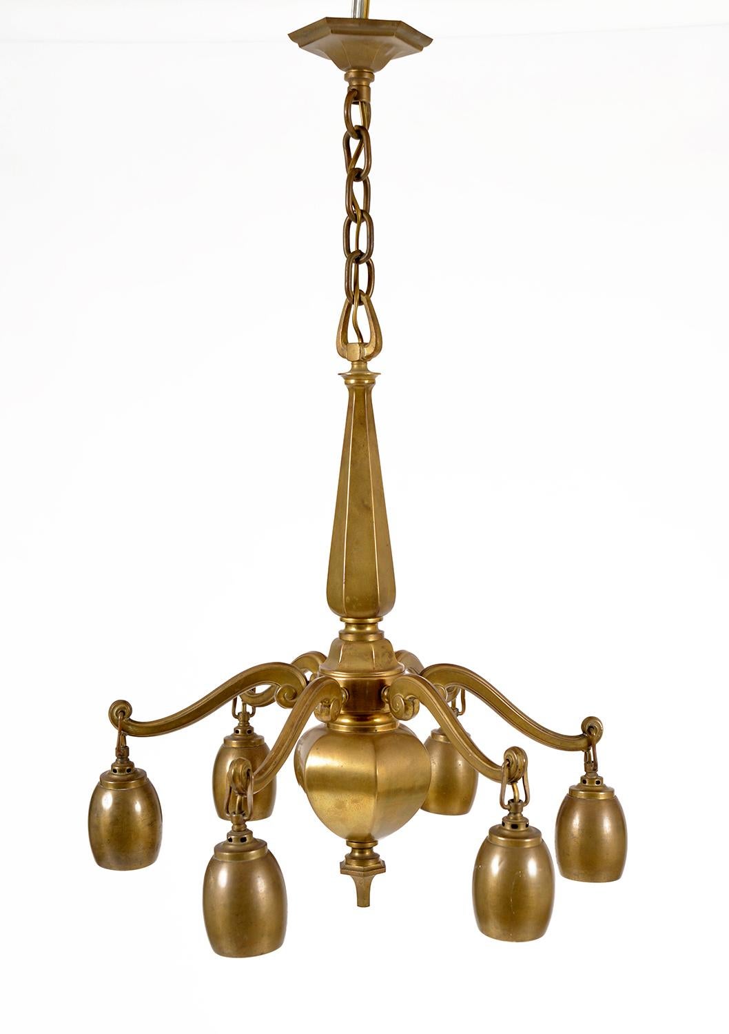 This beautifully patinated solid brass Bohemian ceiling light is unmarked but has a real Teutonic feel, and is likely to have been made in Austria, Germany or the Czech Republic during the early years of the 20th century.
The sculptural brass body