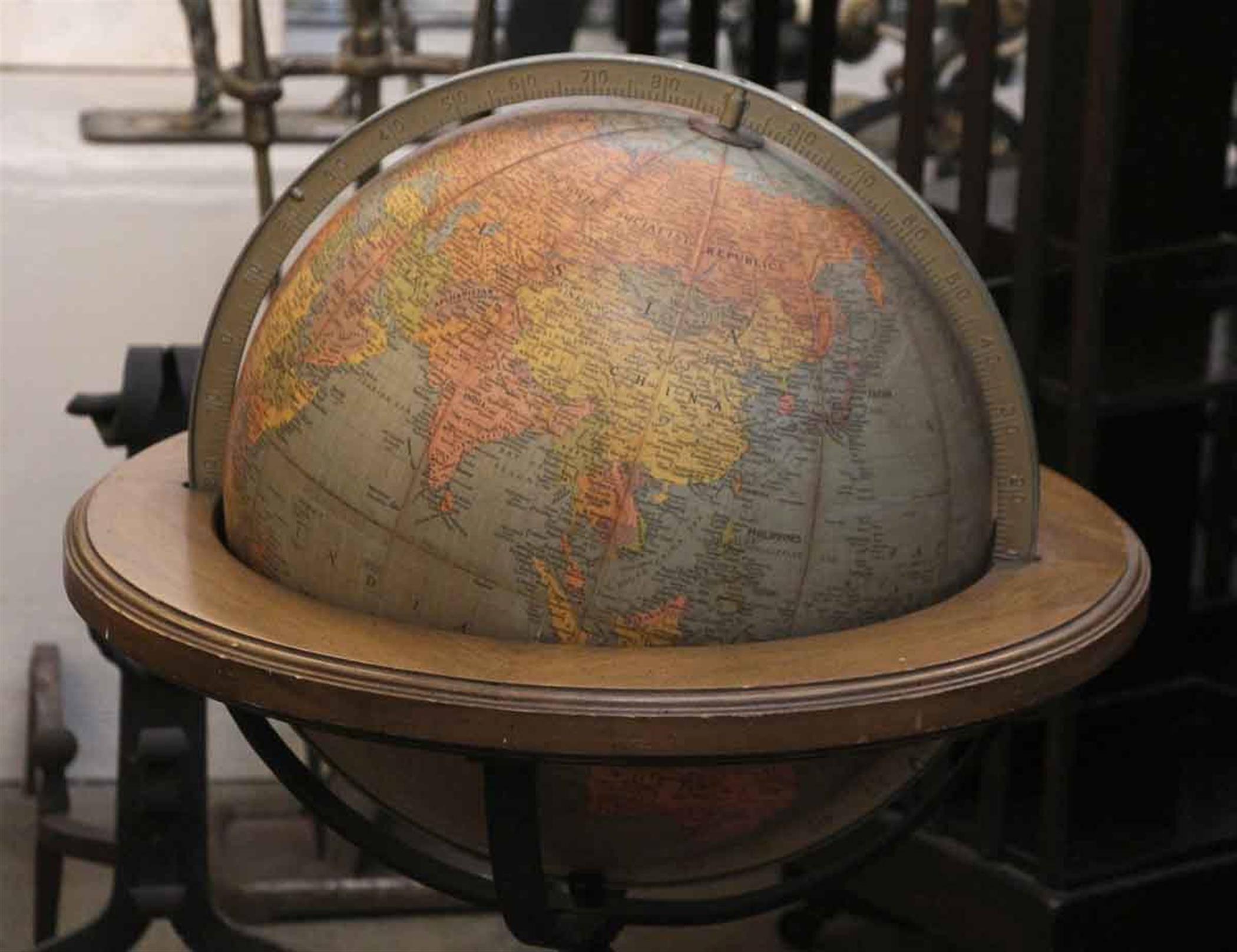 Brandt standing floor library globe on a wrought and cast iron base combination. From the 1920s.