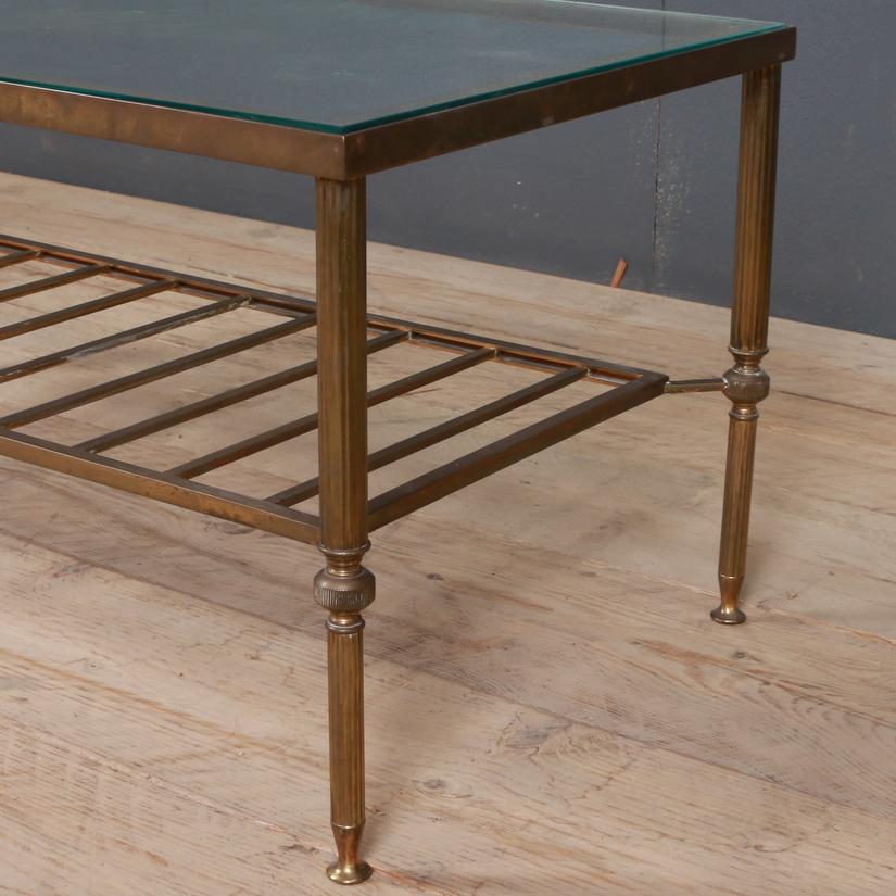 1920s French brass and glass low table with a slatted magazine shelf. Clear glass, 1920

Dimensions:
36.5 inches (93 cms) wide
18.5 inches (47 cms) deep
16.5 inches (42 cms) high.

 
