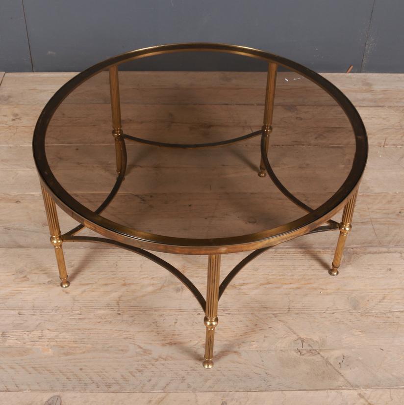 1920s French brass and glass circular low table. Smoked glass, 1920.

Dimensions
16.5 inches (42 cms) high
30.5 inches (77 cms) diameter.

   