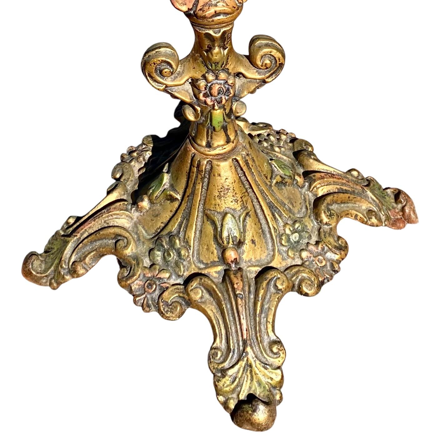 An antique 1920’s brass and metal floor lamp in a moorish style and with an outstanding vintage stained glass Dragon “swirl” Tiffany style shade.

Whether you're looking to enhance your home's living room, bedroom, or hallway, or you want to add a