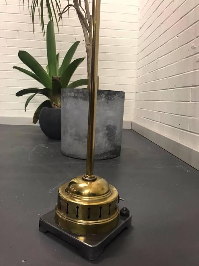 1920s brass Miller Sunlamp l floor lamp industrial antique spotlight

Details:
- Era: Industrial
- Date of Manufacture: 1920s
- Materials: Brass Stand and aluminum shade and steel
- Condition: Excellent, strong and sturdy.
- Wear: Wear consistent