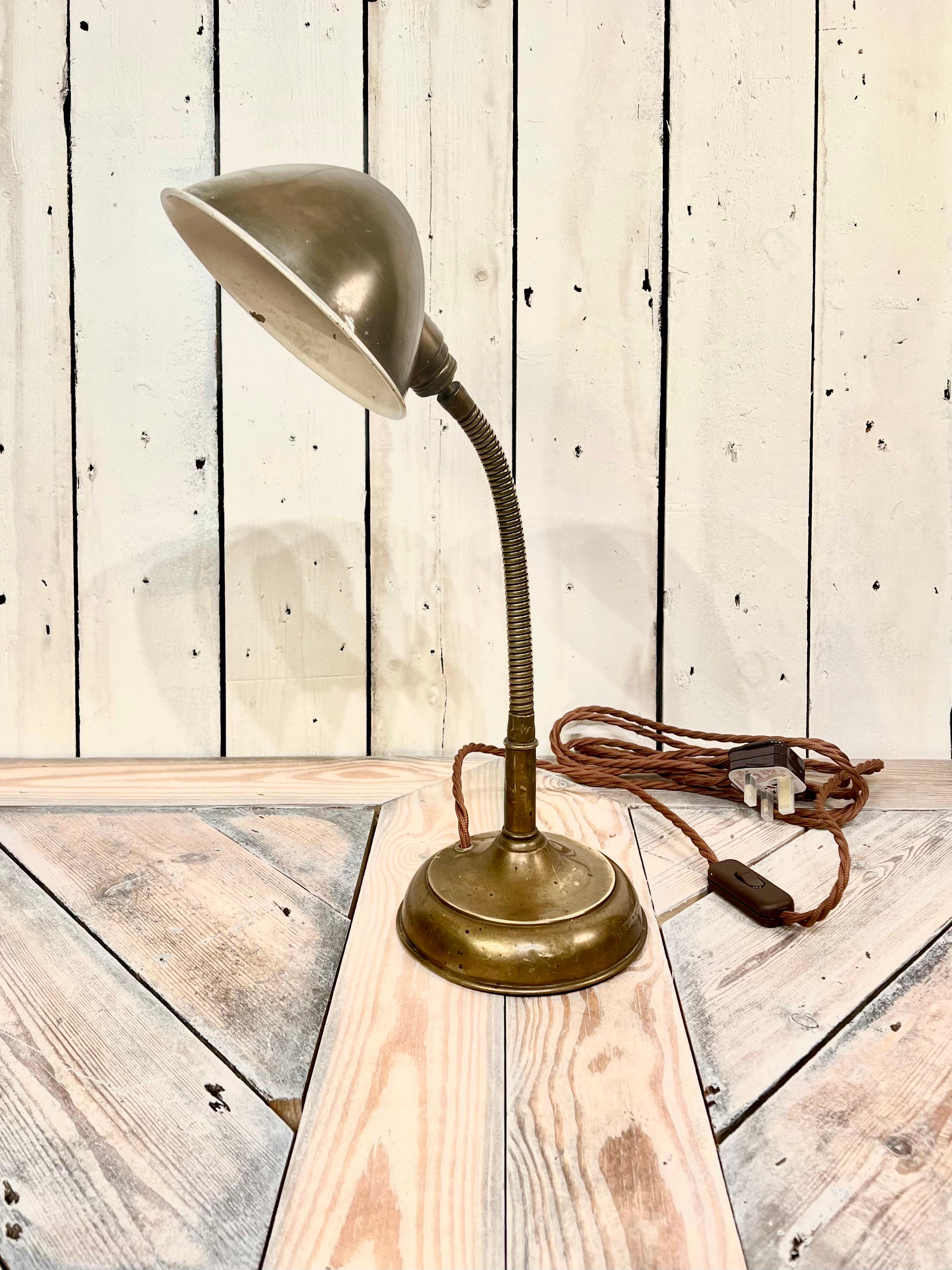 This handsome 1920's Brass, Miller Table Lamp, Model (1091), is a true collector's item for the most discerning collector. Made in the U.S, this lamp features a beautiful Brass finish that exudes elegance and sophistication. The lamp's simple form
