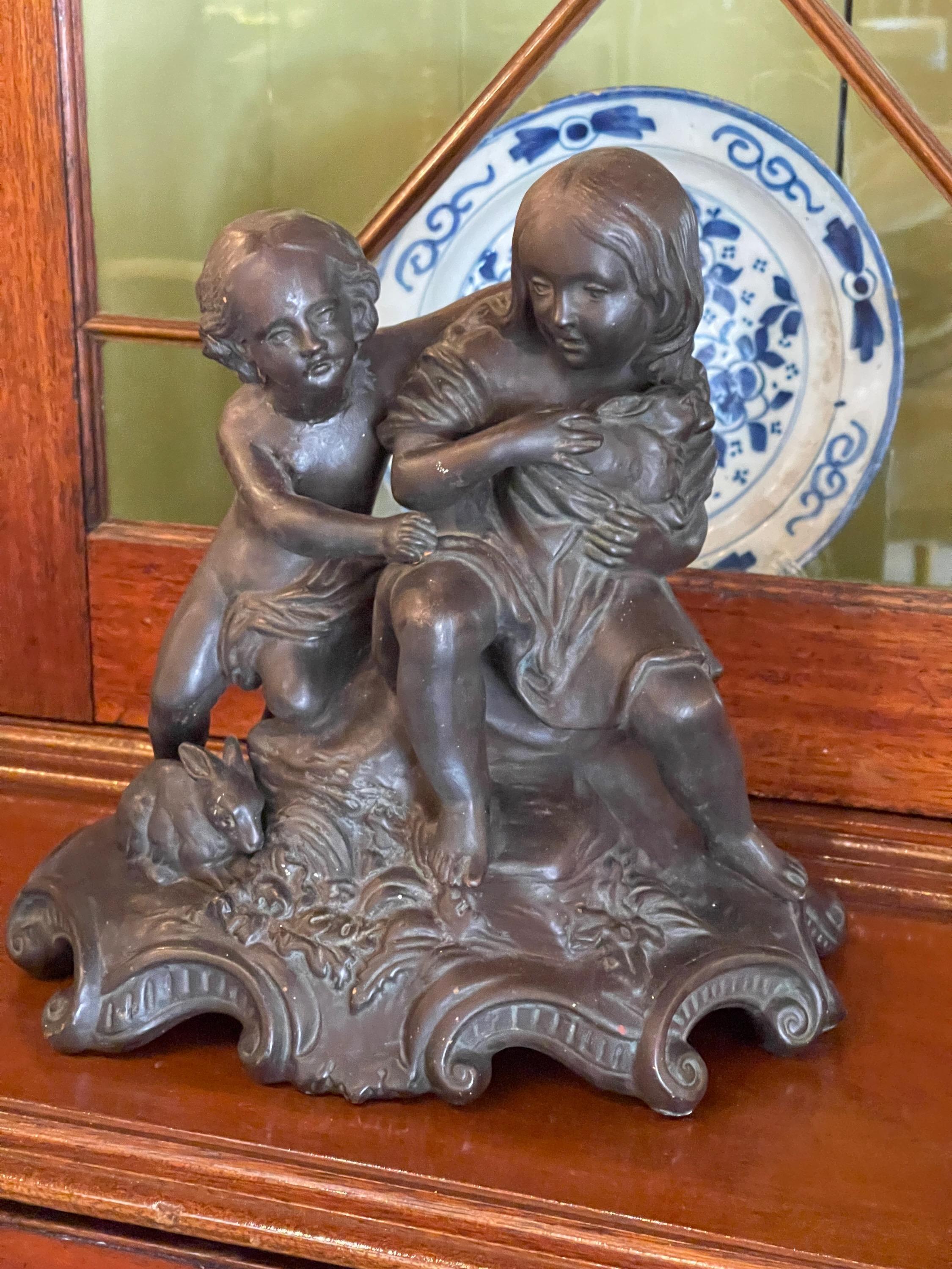 1920s Bronzed Sculpture of Children with Rabbits In Good Condition For Sale In Charlottesville, VA