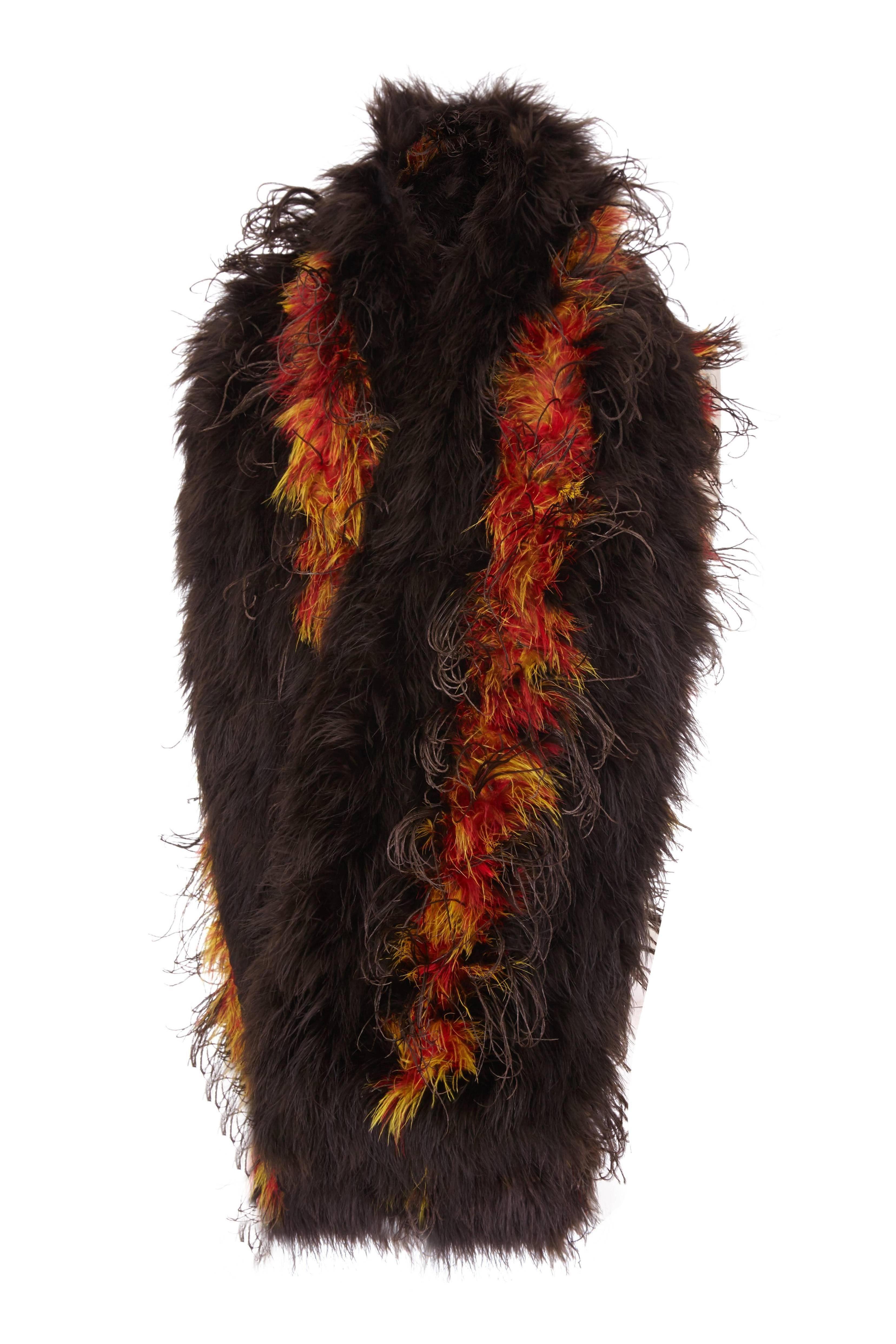 This is an entirely original 1920s marabou feather stole in wide sections of rich dark brown interspersed with a brighter mix of red, orange and yellow stripes of barbs. The look reminds me of a fire bird and these highlights have the more desirable