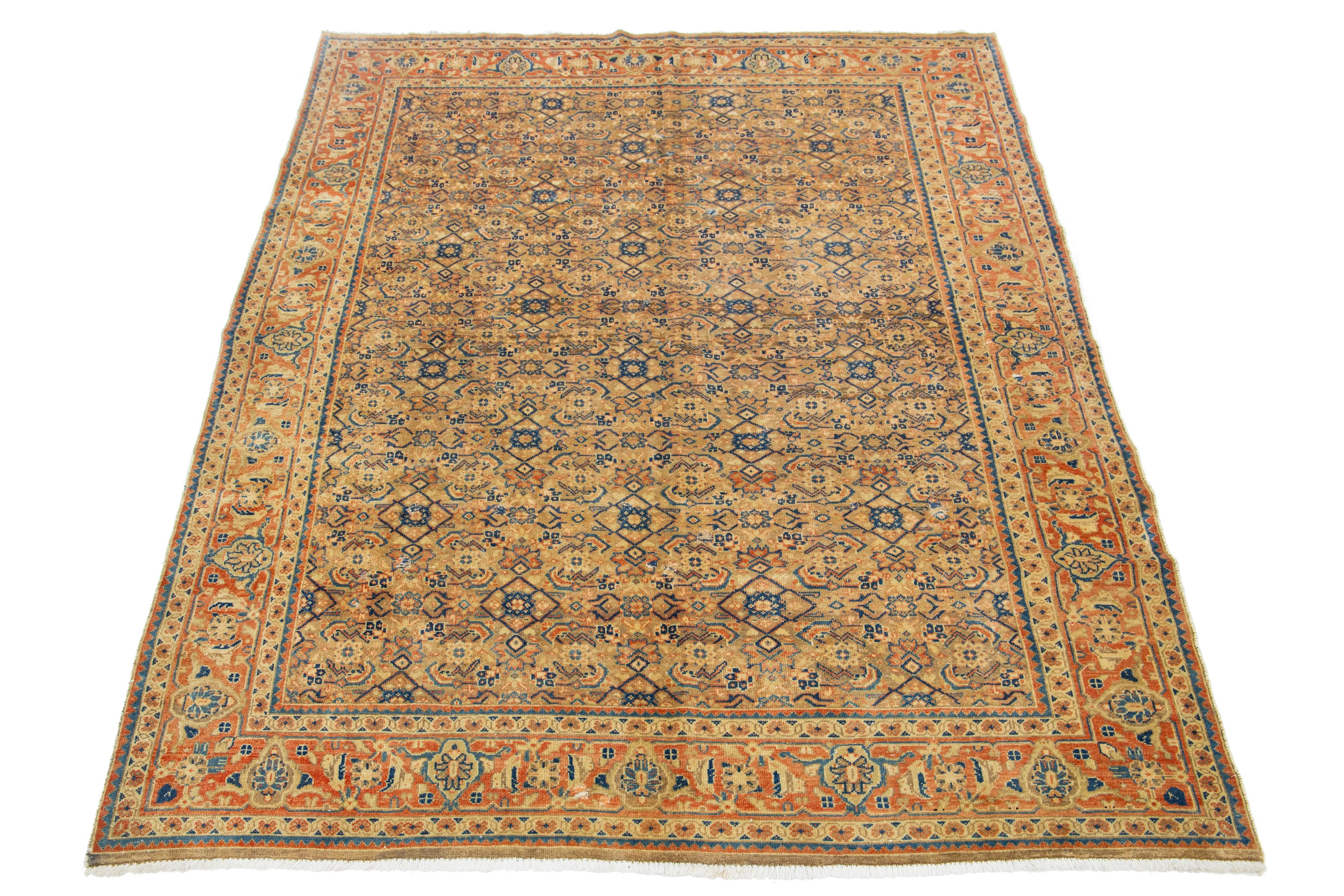 A Persian Mahal wool rug features a meticulously crafted, classic floral pattern. The design is enhanced by using contrasting colors, such as brown, rust, and blue, within the field.

This rug measures 7' X 10'5