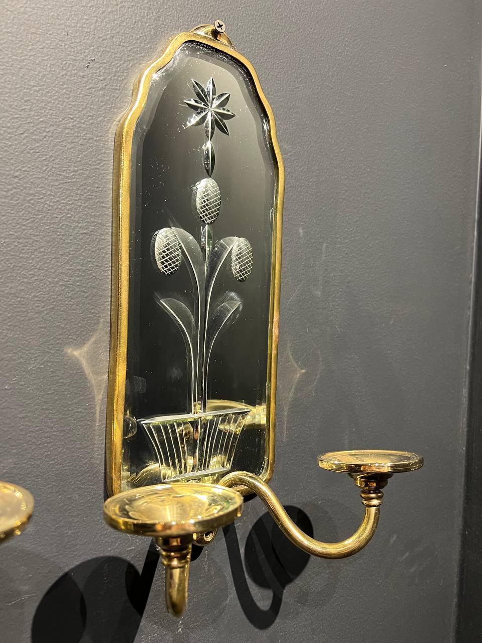 A pair of circa 1920’s Caldwell etched mirrored backplate sconces with two lights