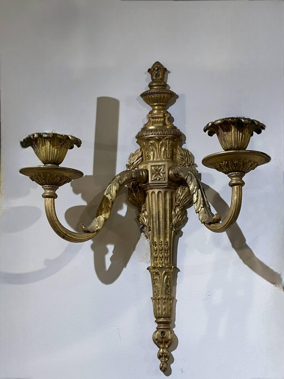 A pair of 1920's Caldwell Empire style bronze double light sconces