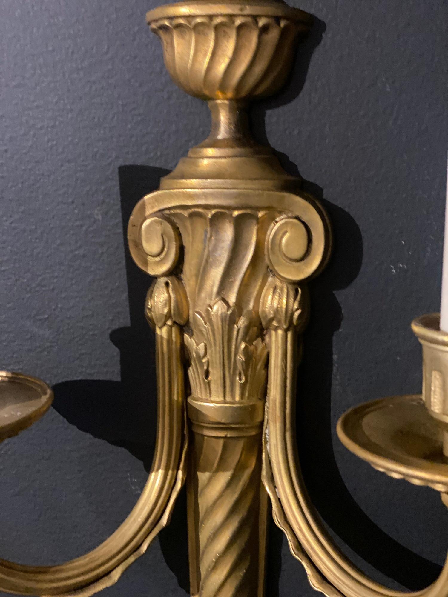 A pair of circa 1920’s Caldwell gilt bronze sconces with two lights