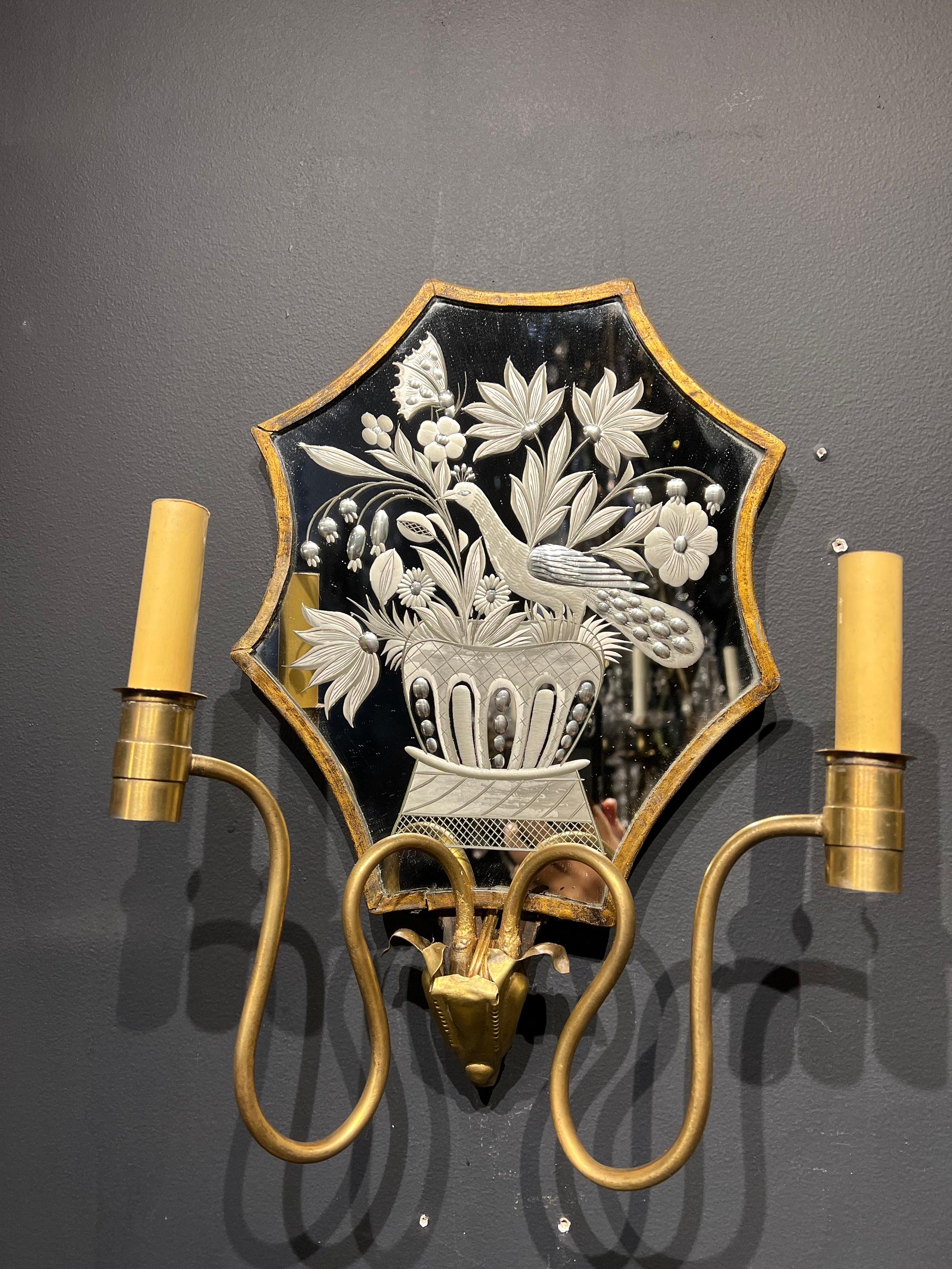 A pair of circa 1920’s Caldwell mirrored backplate sconces with bird’s design on mirror . In very good vintage condition. 

Up to 120V (US Standard)
Hardwired

Dealer: G302YP 

