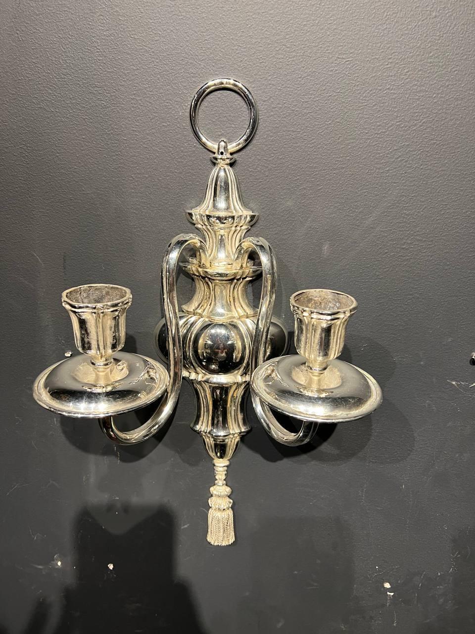 A pair of circa 1920’s Caldwell silver plated sconces with two lights