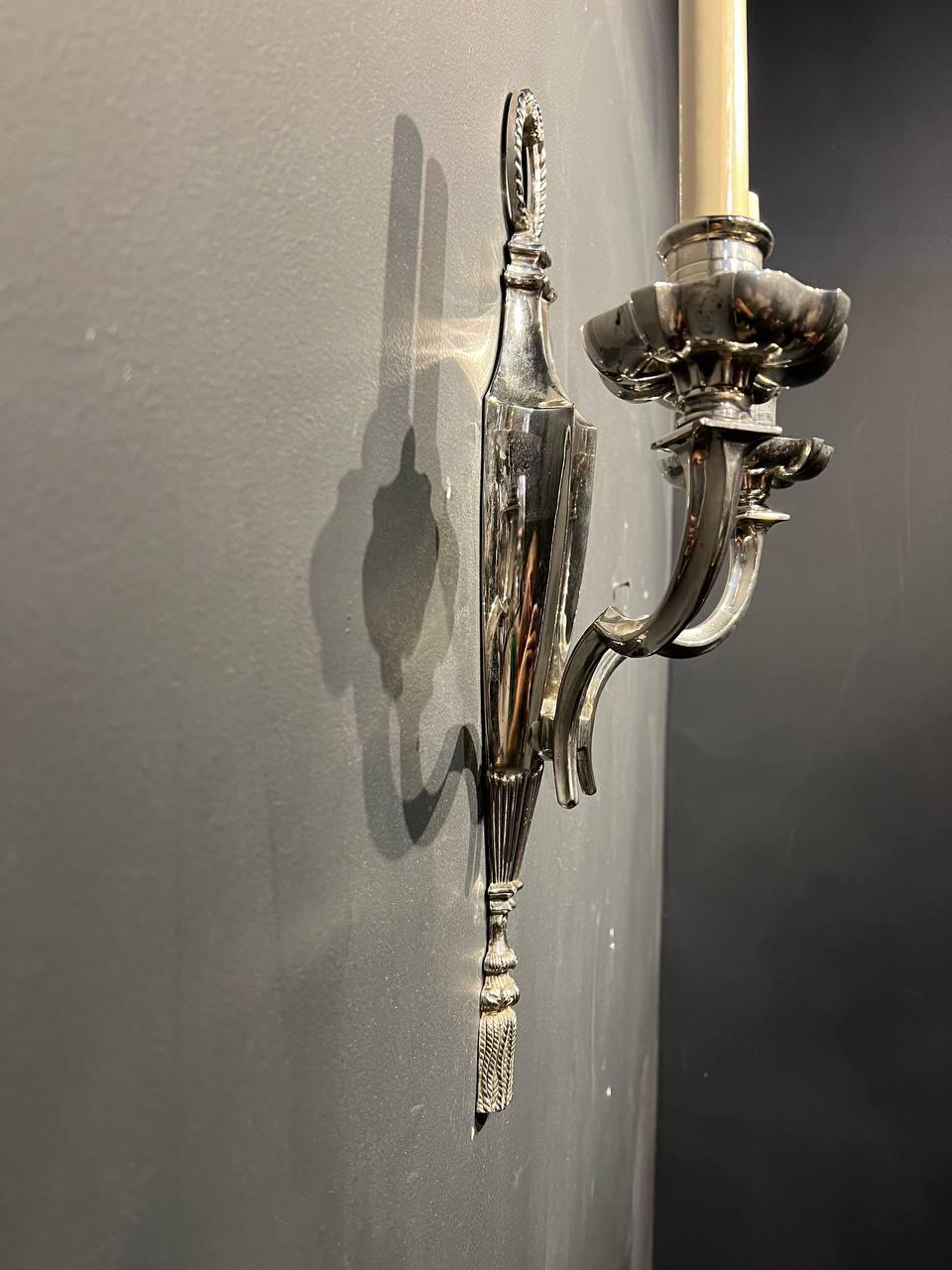 A pair of circa 1920’s Caldwell silver plated sconces with two lights 