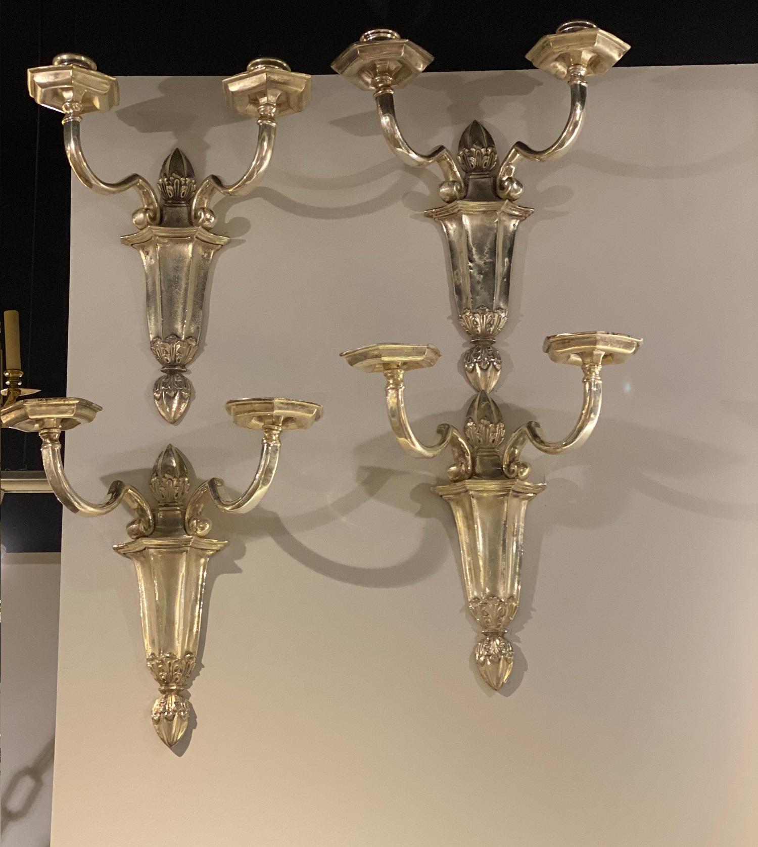 A pair of circa 1920’s silver plated Caldwell sconces with two lights