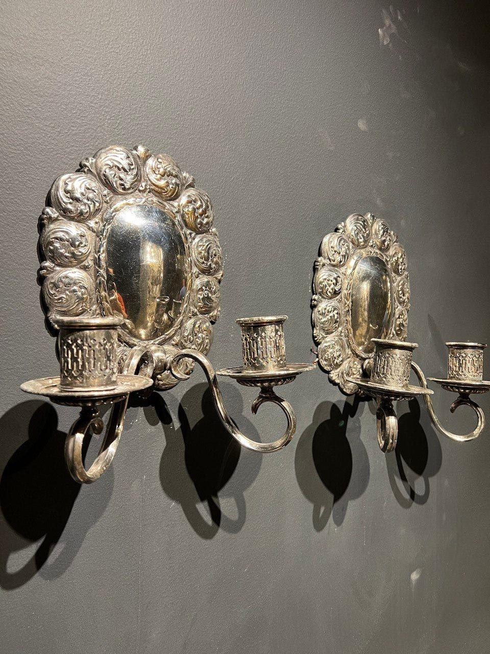 A circa 1920's Caldwell silver plated sconces with wave design and two lights