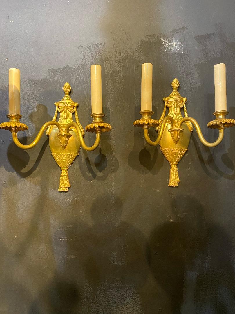 A pair of circa 1930's Caldwell small gilt bronze sconces, neoclassic style