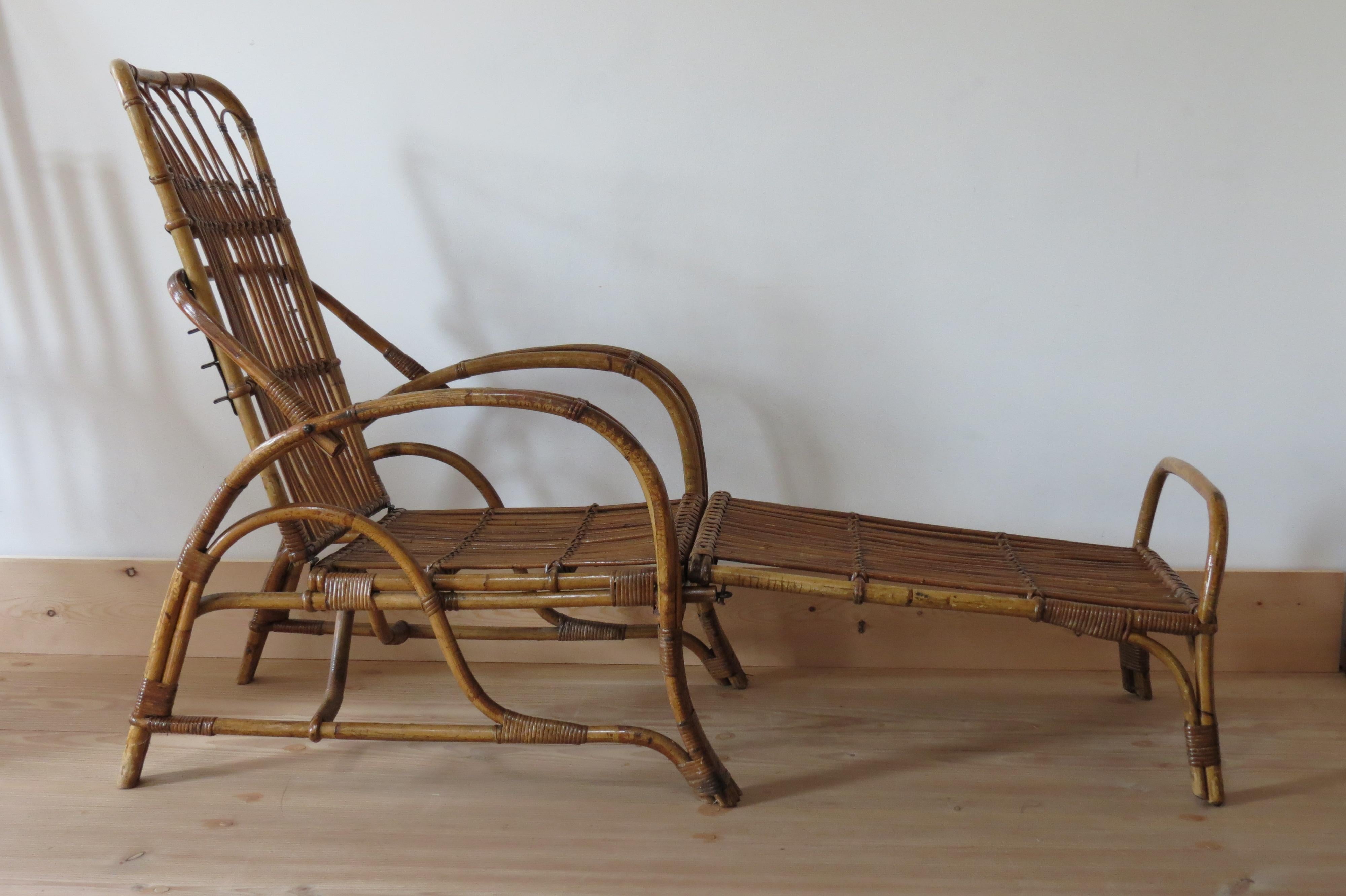 A very stylish 1920s steam bent cane and bamboo chair with detachable footstool. Adjustable backrest allows the chair to recline into several positions. The footstool detaches so the chair can be used independently.  Can be used indoors or outdoors.