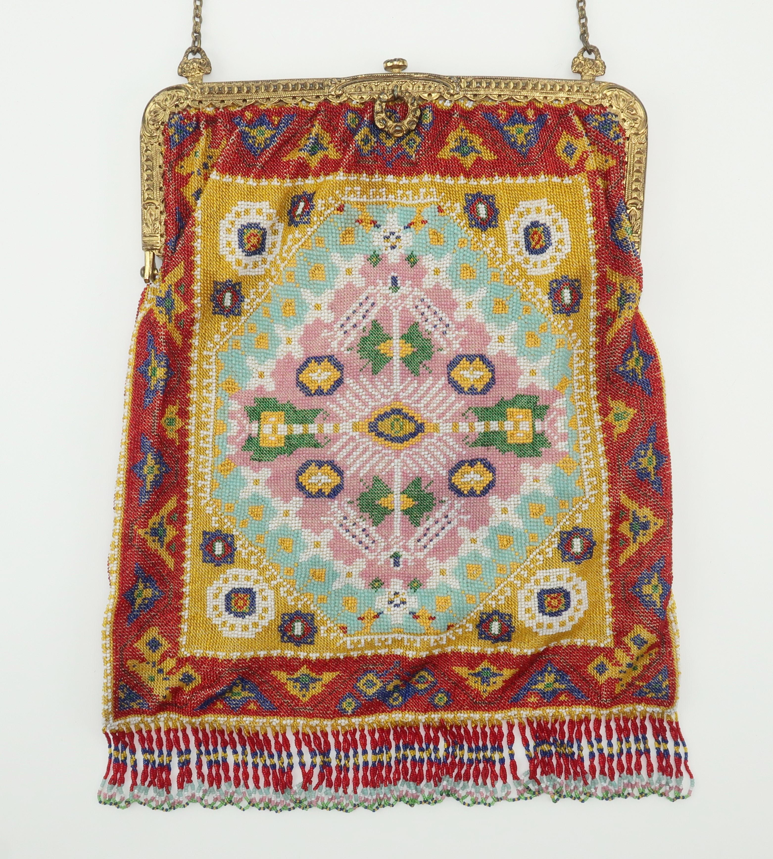 Micro beaded handbags from the 1800’s and early 1900’s are amazing examples of a handmade art form that are as beautiful to look at as they are to carry.  This rather large example displays the colorful image of an exotic rug complete with looped